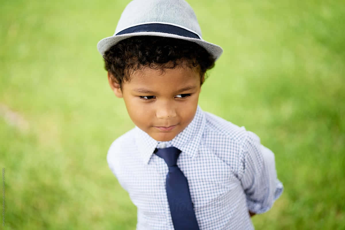 Stylish Mixed Race Boyin Hat Wallpaper