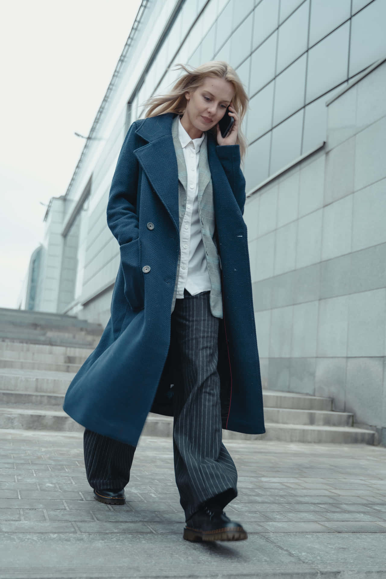 Stylish Navy Blue Peacoat For A Chic Winter Look Wallpaper