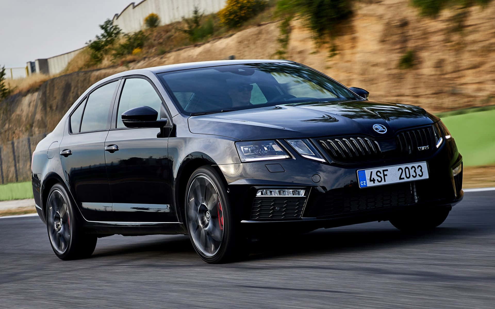 Stylish Skoda Octavia Gliding Through Nature Wallpaper