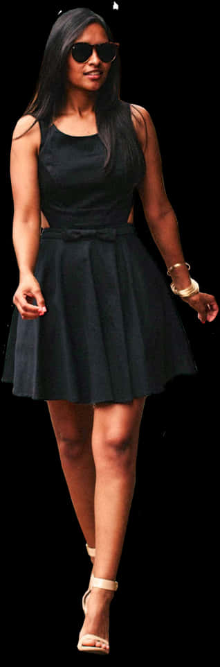 Stylish Woman Walkingin Black Dress PNG