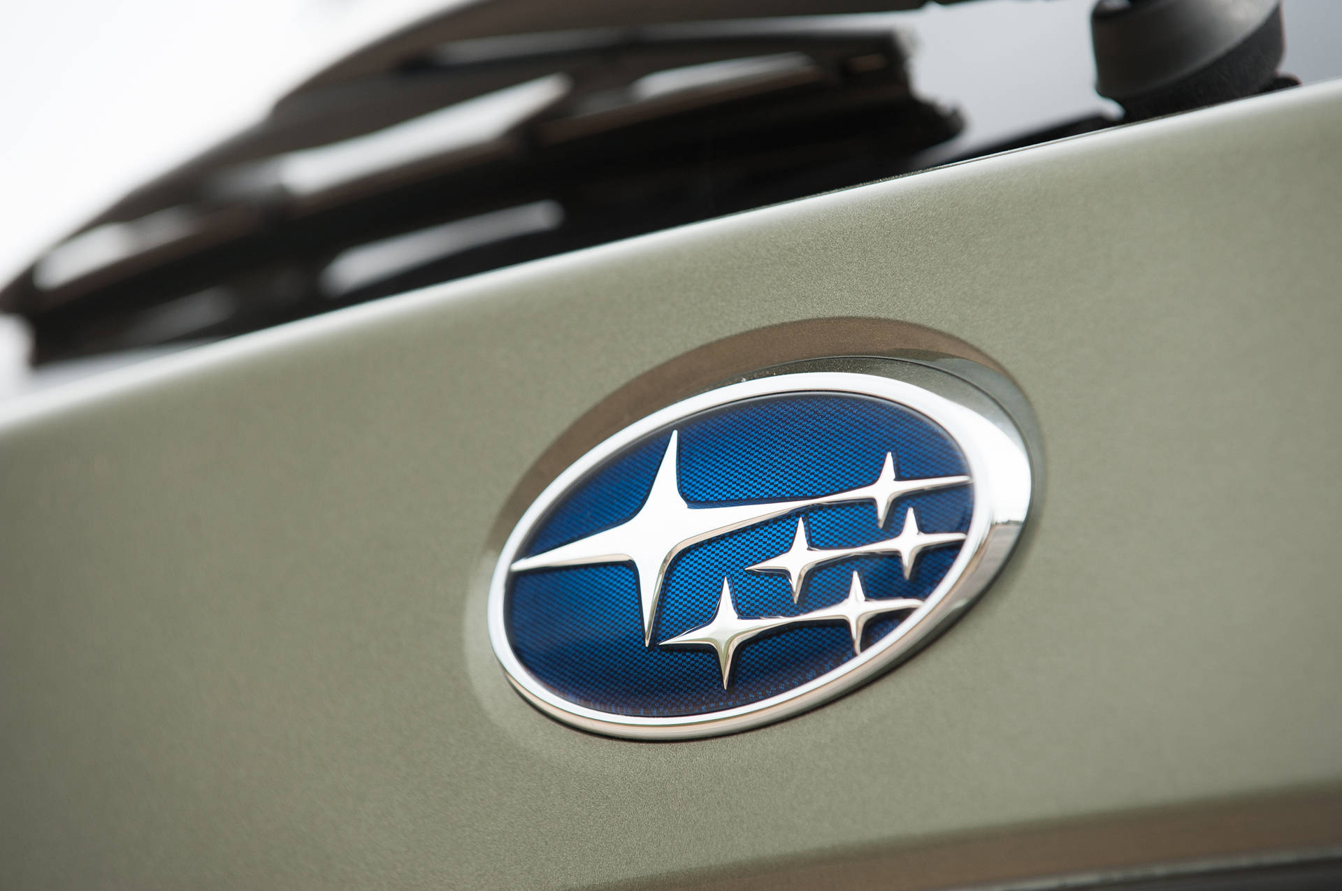 Subaru Logo On Gray Car Wallpaper