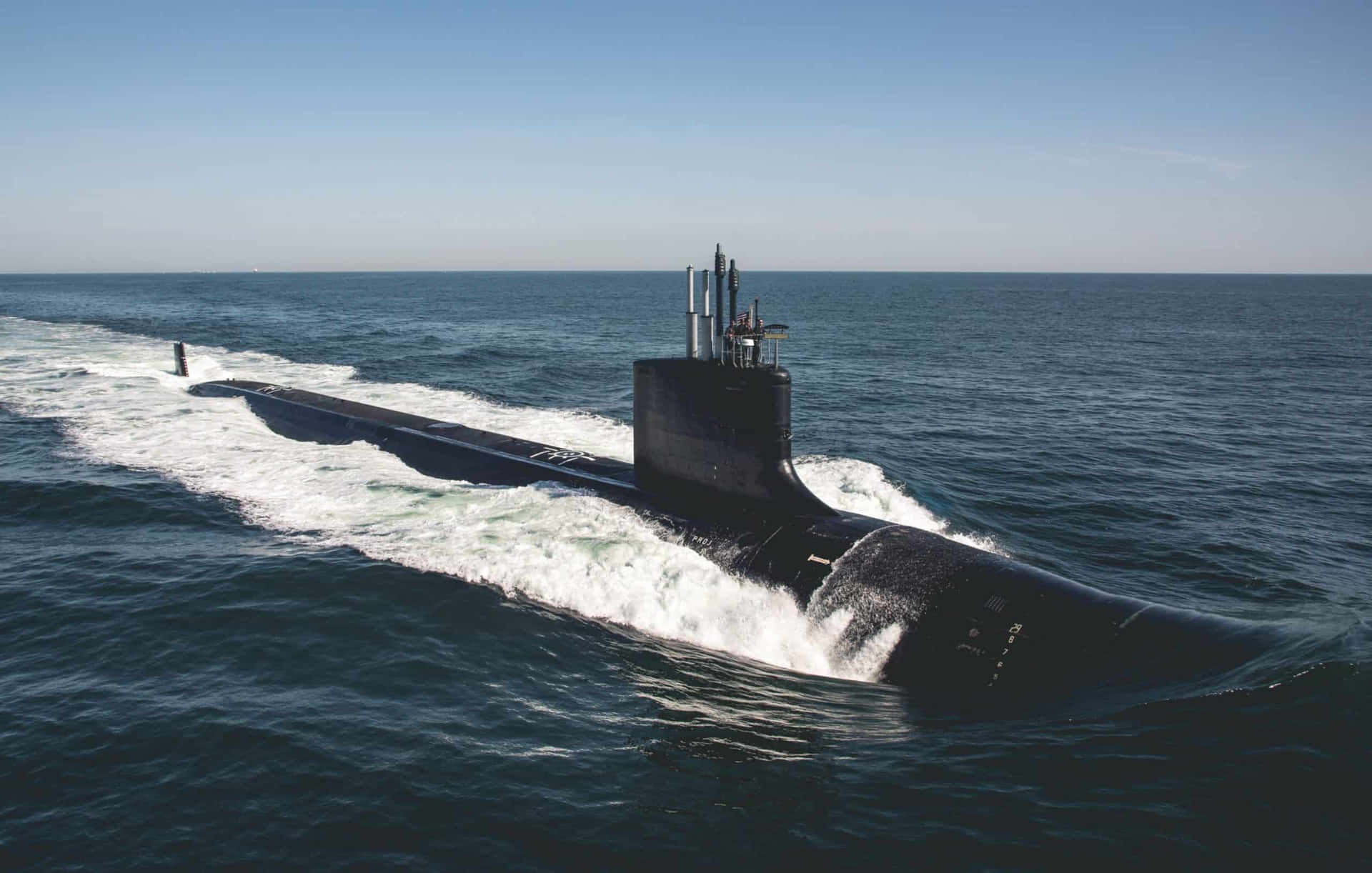A Black Submarine Is Traveling In The Ocean