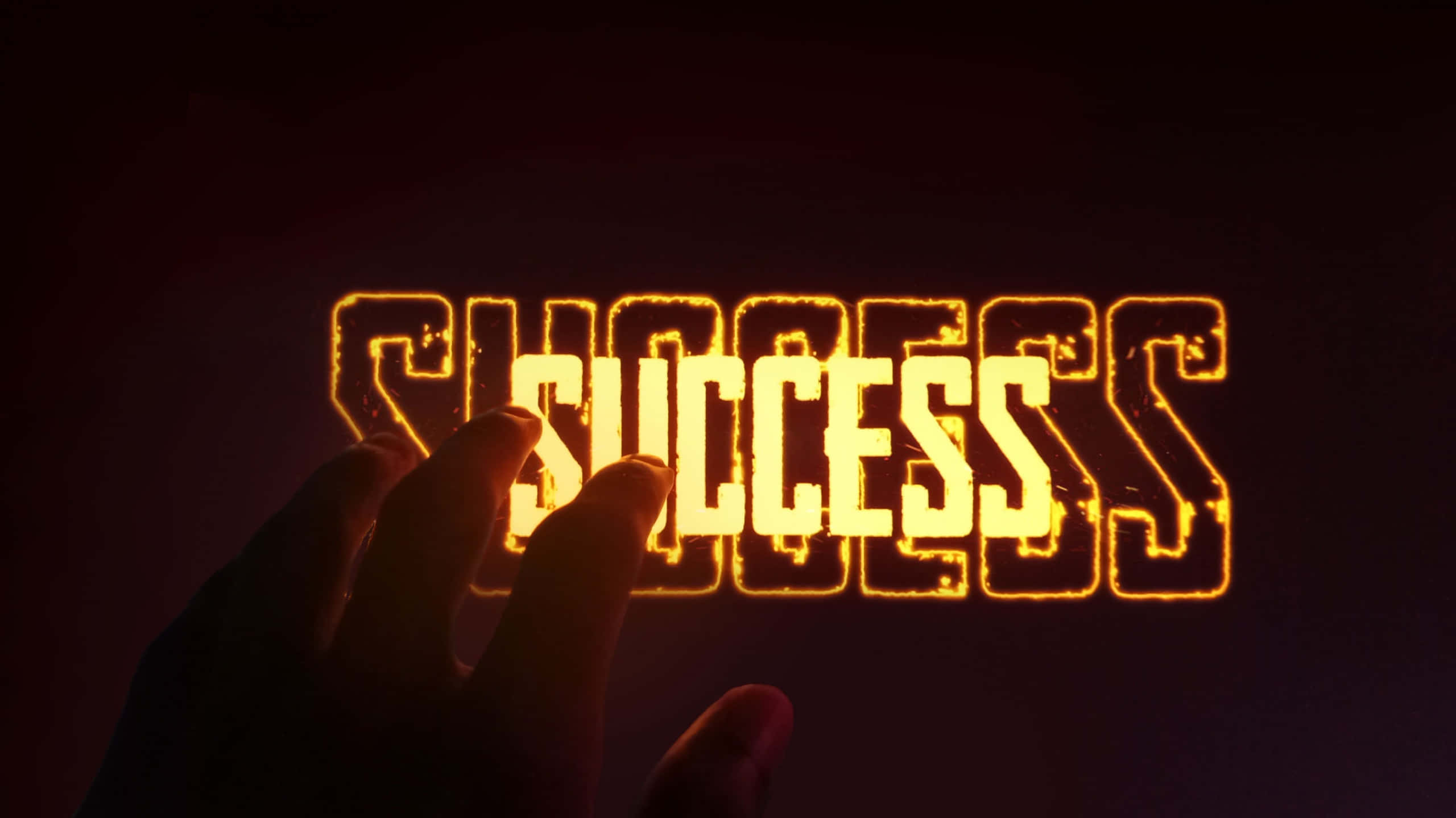 A Hand Holding The Word Success In Front Of A Dark Background