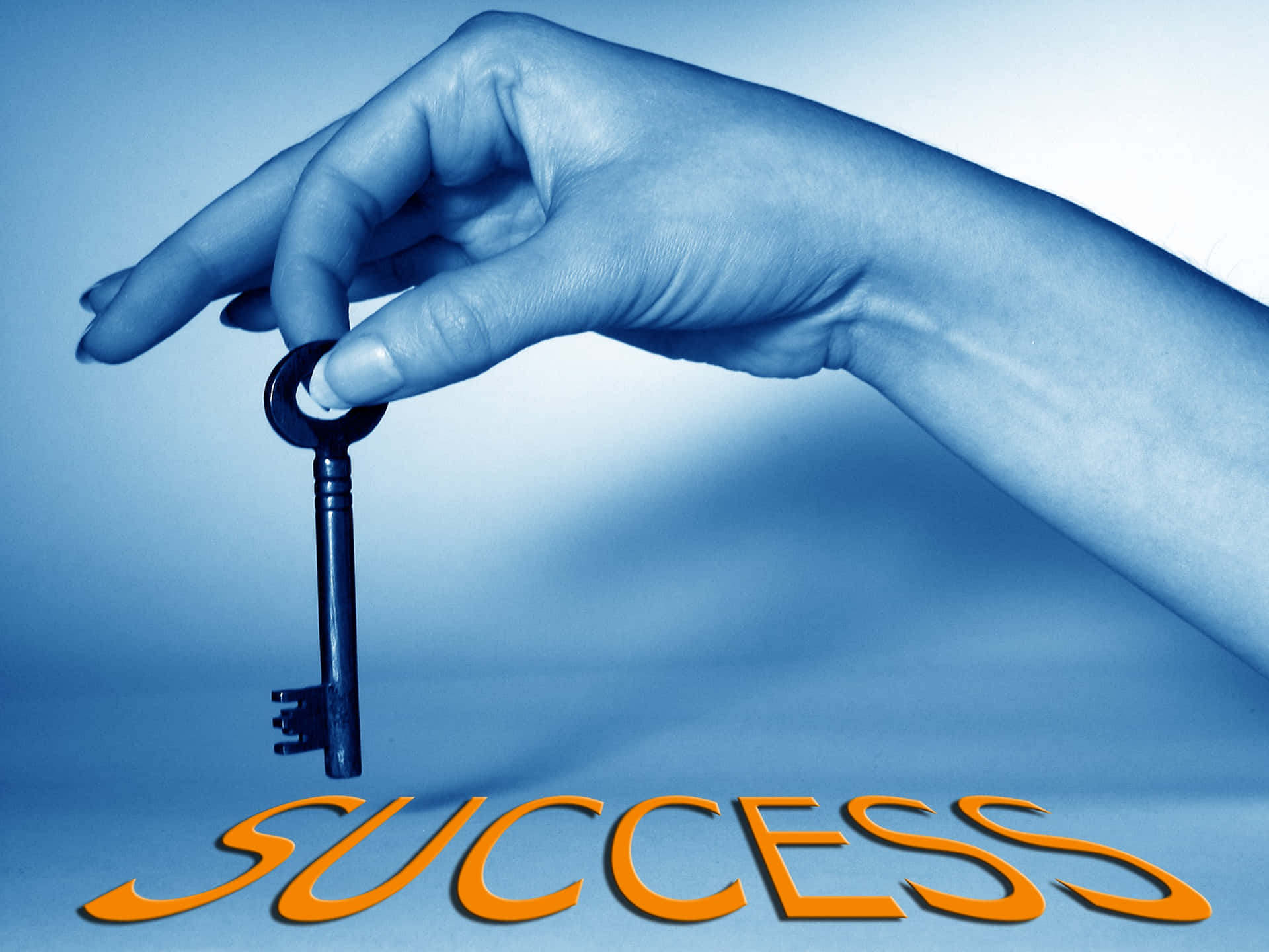 A Person Holding A Key To Success