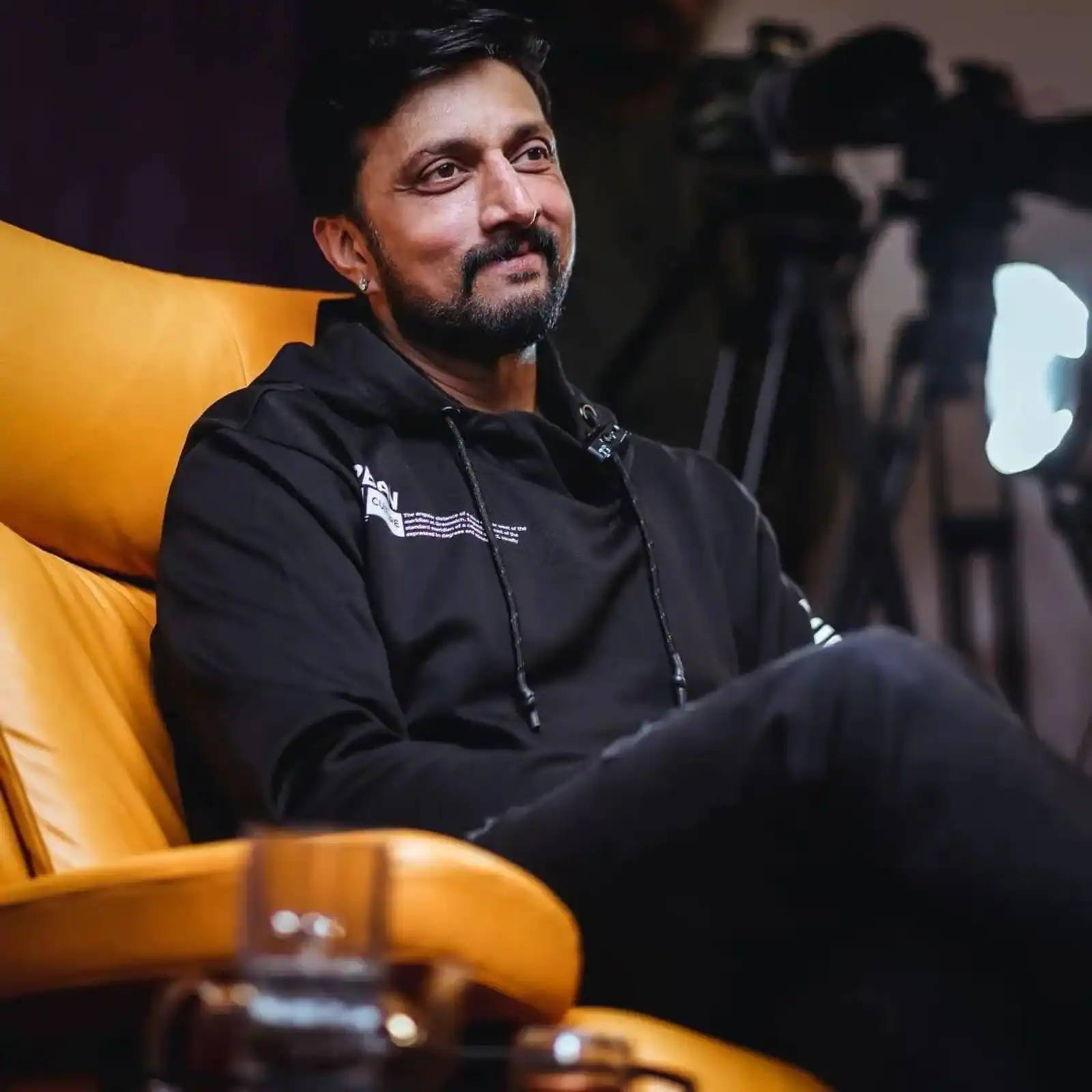 Sudeep Comfy In A Yellow Chair Wallpaper