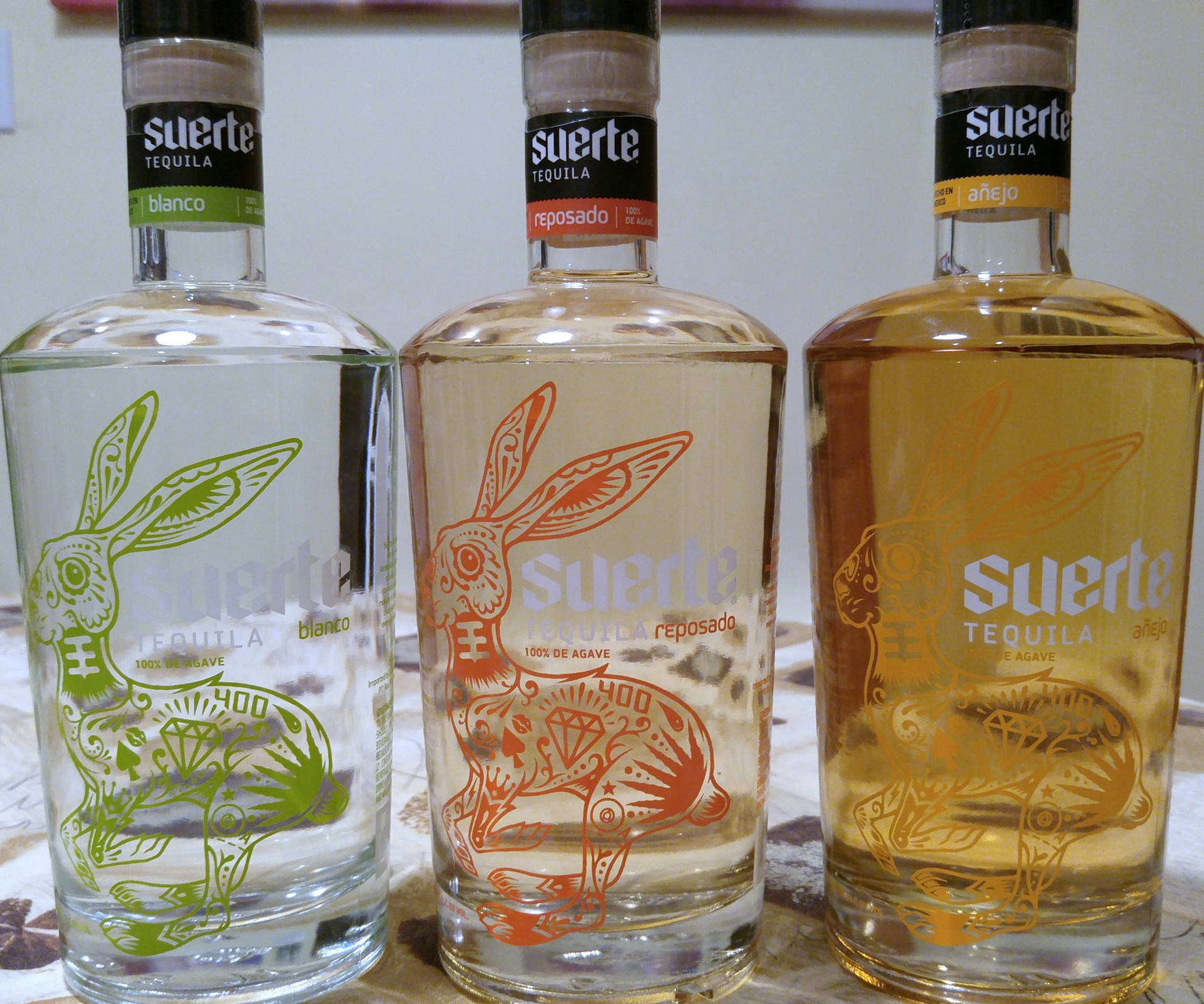 Exquisite Collection of Suerte Tequila Bottles Wallpaper