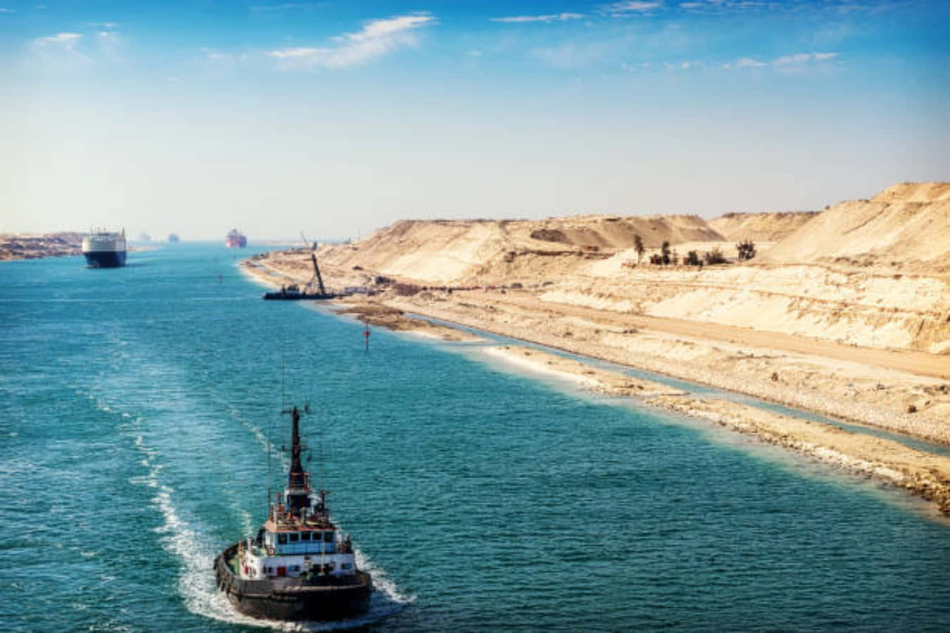 Ships passing through the Suez Canal, a vital trade route linking the Mediterranean Sea to the Red Sea