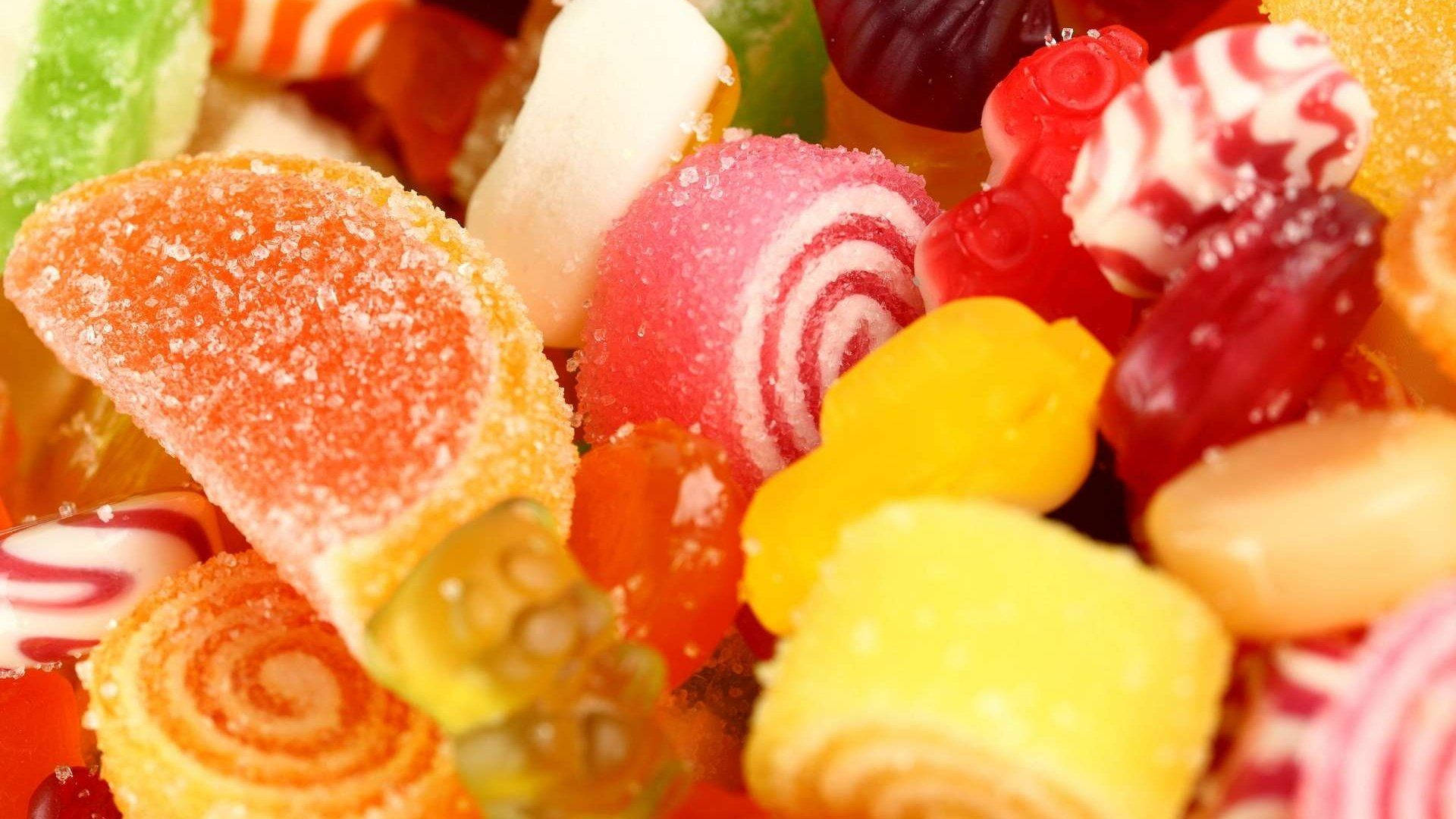 Sugar Coated Candies In Different Sizes And Shapes Wallpaper