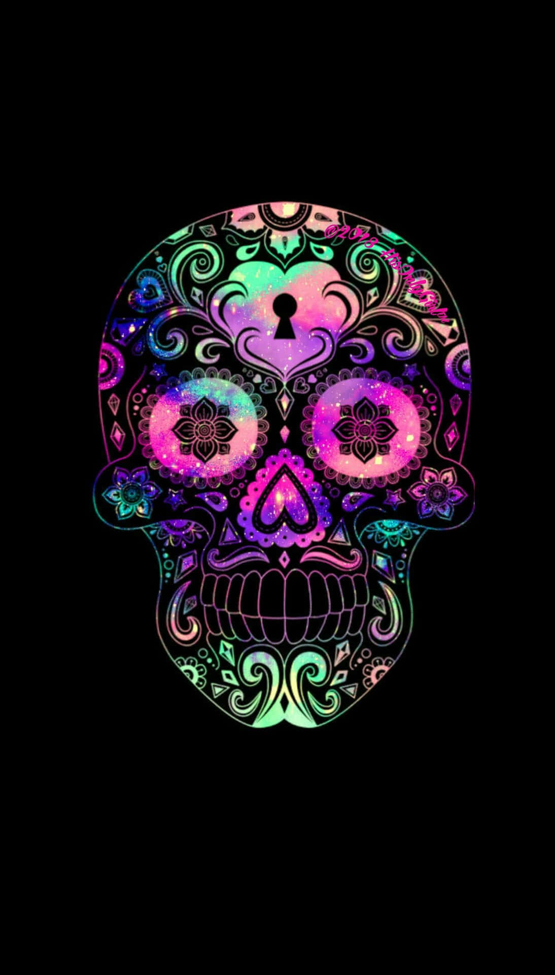 a colorful sugar skull on a black background