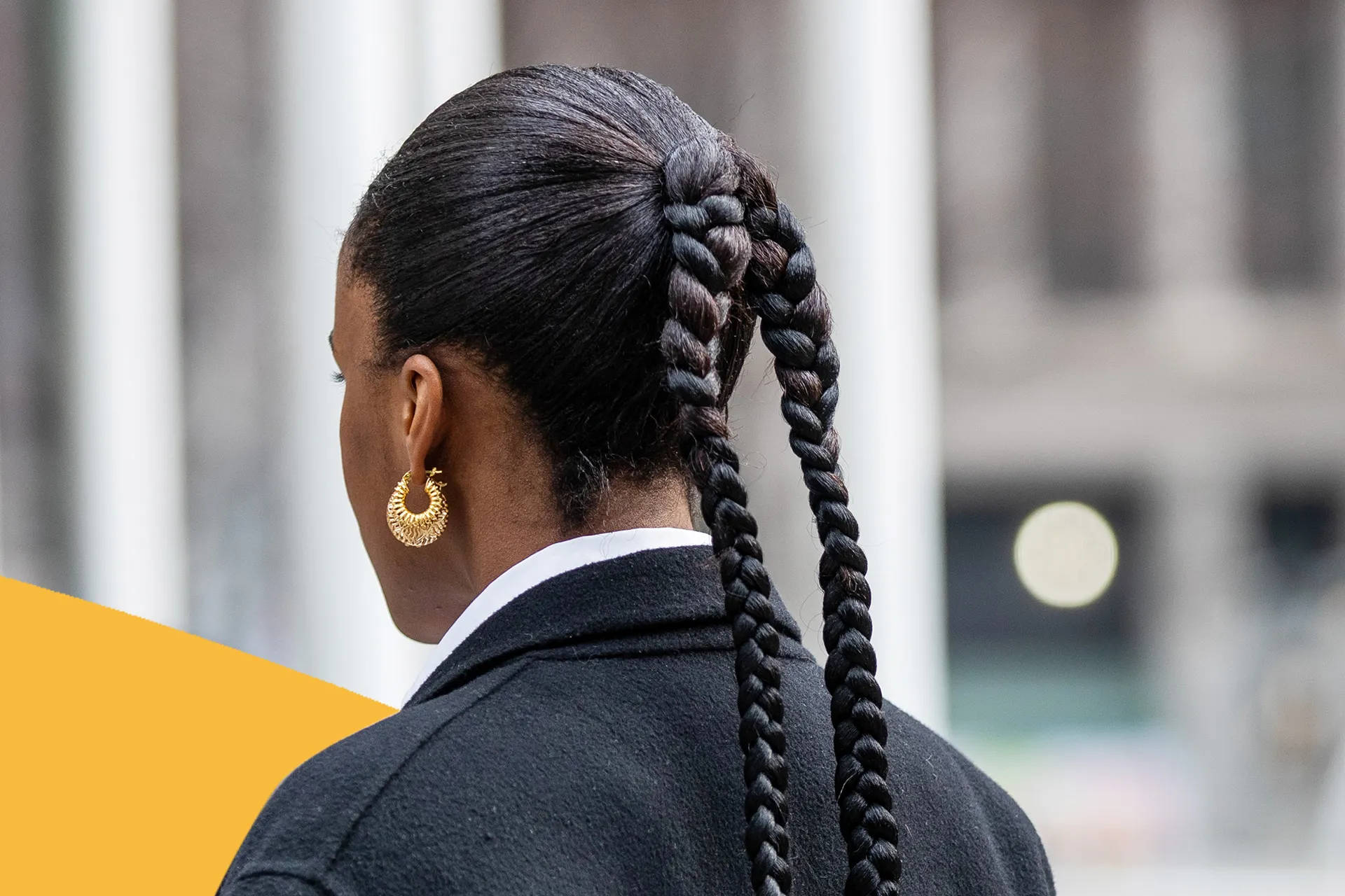 Woman Empowerment in Corporate Fashion - Boss Lady in a Suit with Stylish Braids Wallpaper