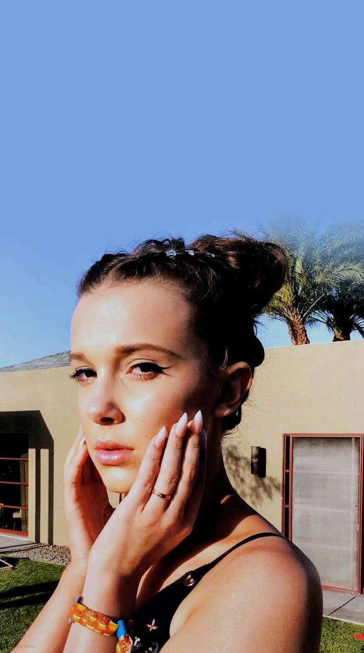 Actress Millie Bobby Brown enjoying the summer season in style Wallpaper
