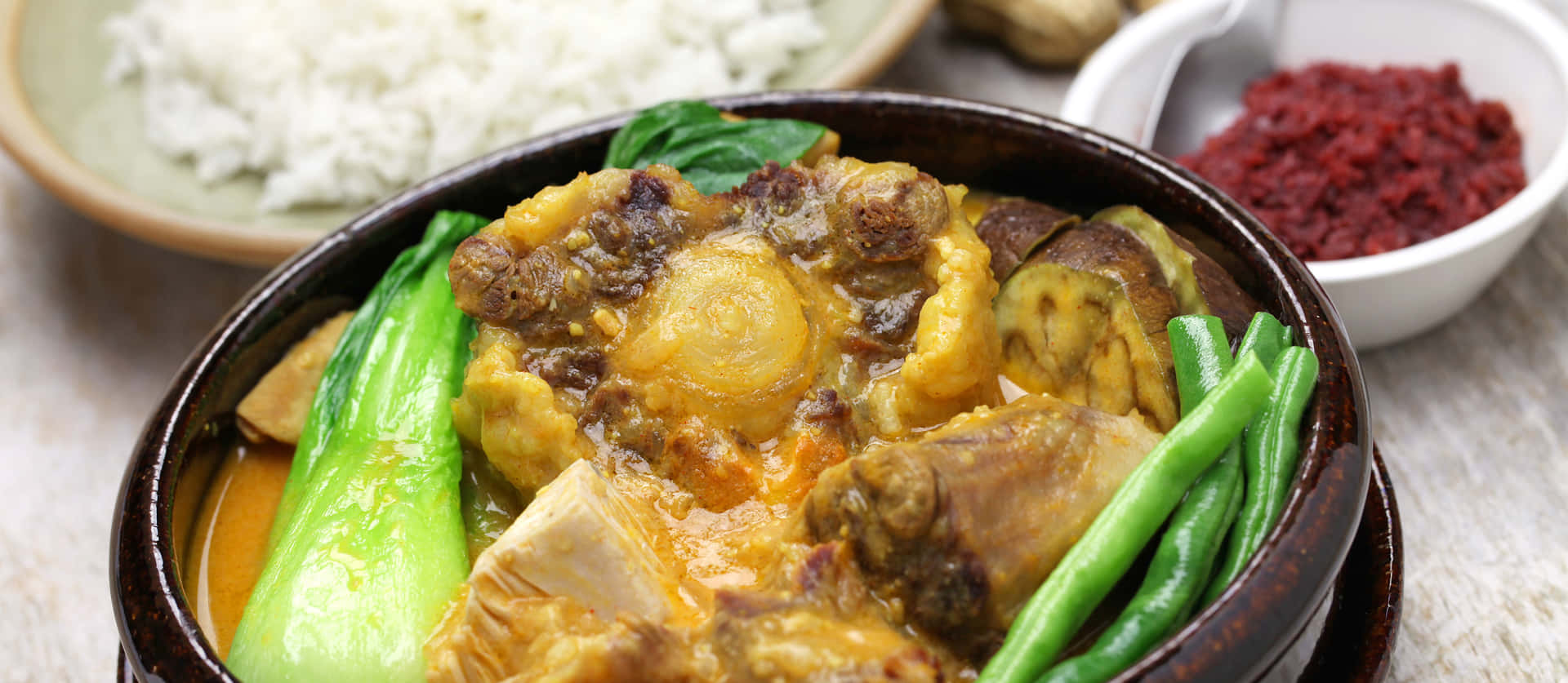 Sumptuous Meal With A Serving Of Rice And Kare-kare Wallpaper