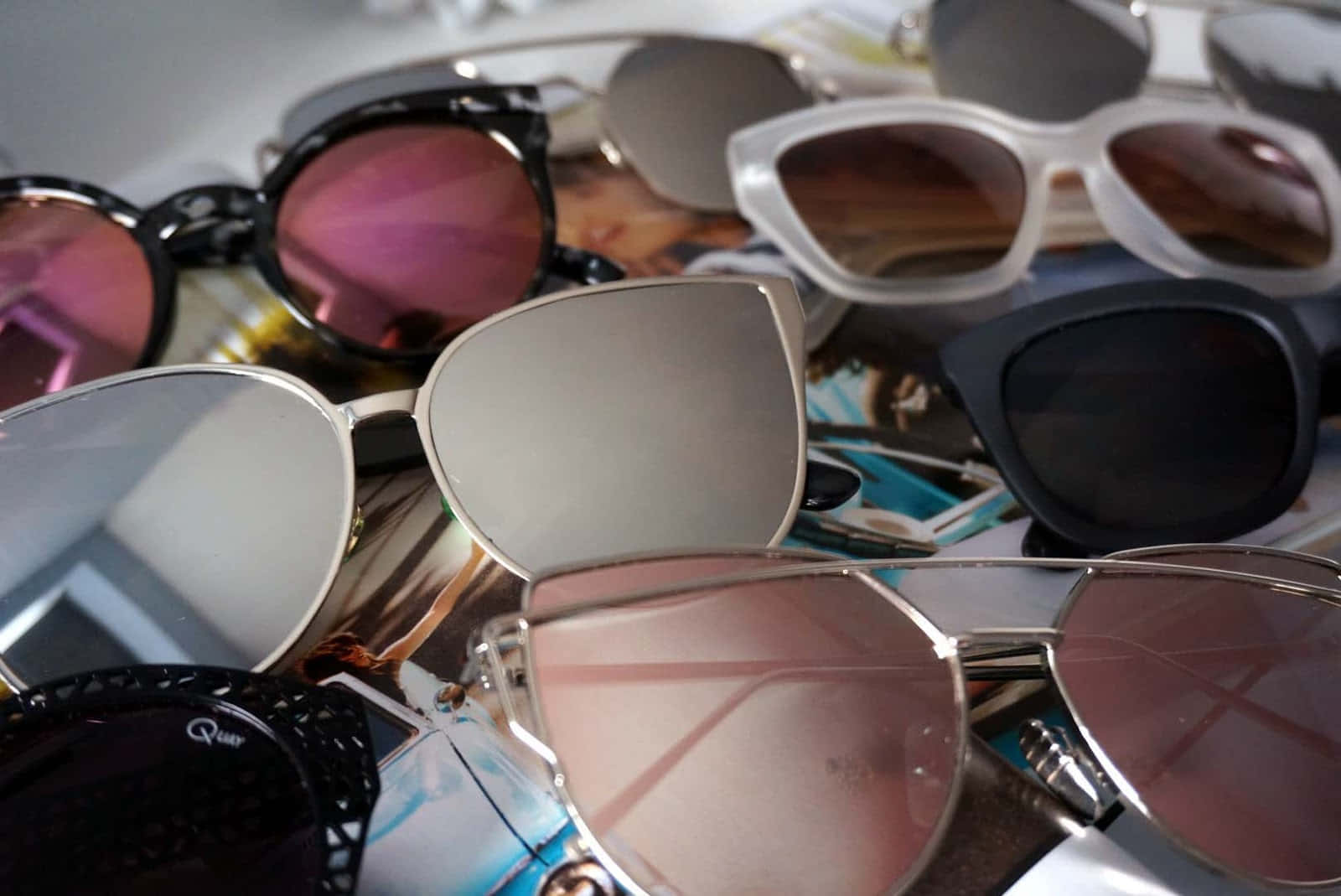 Download A Group Of Sunglasses Are Laying On Top Of A Table ...