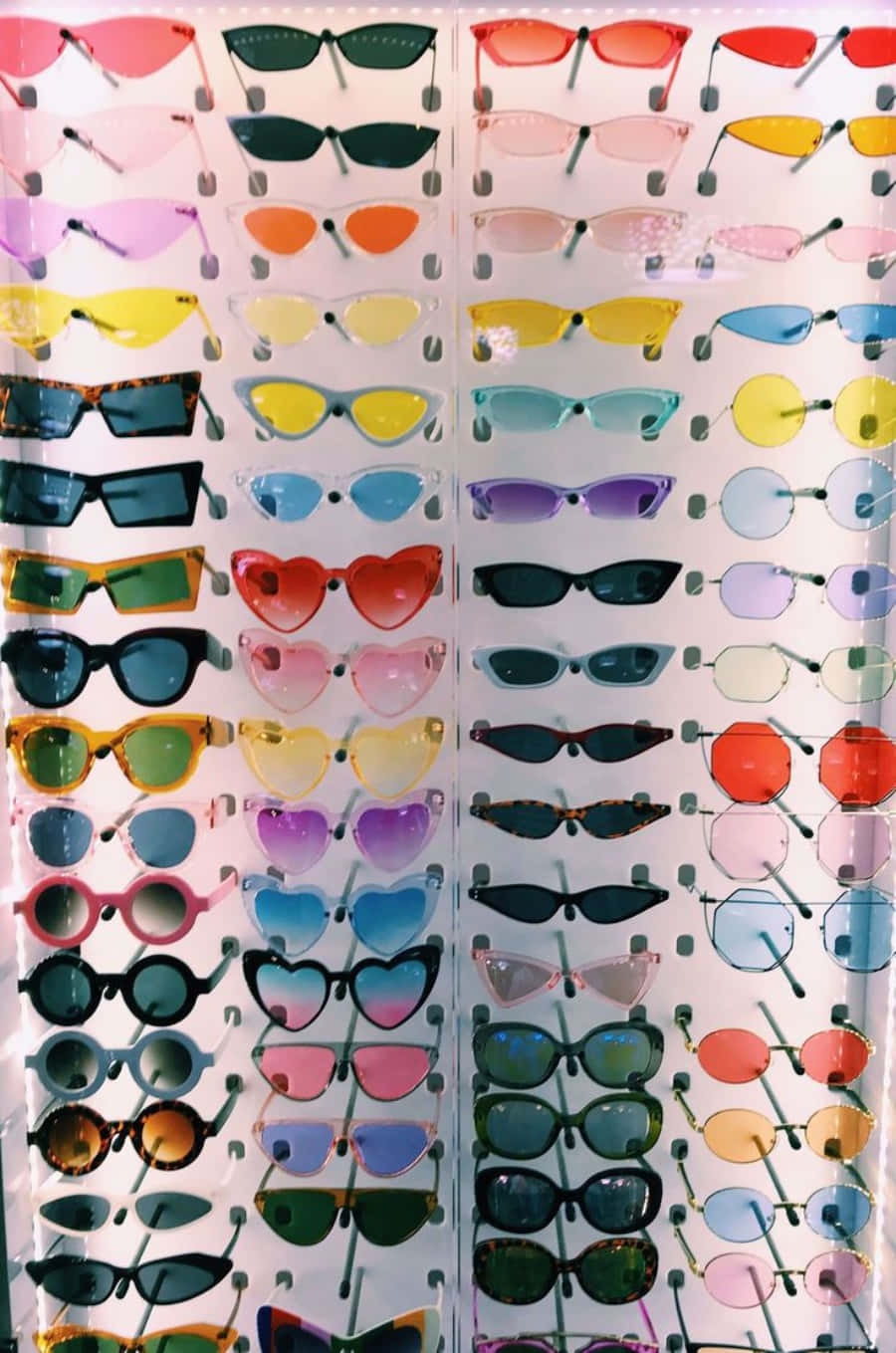 A Display Of Colorful Sunglasses In A Store