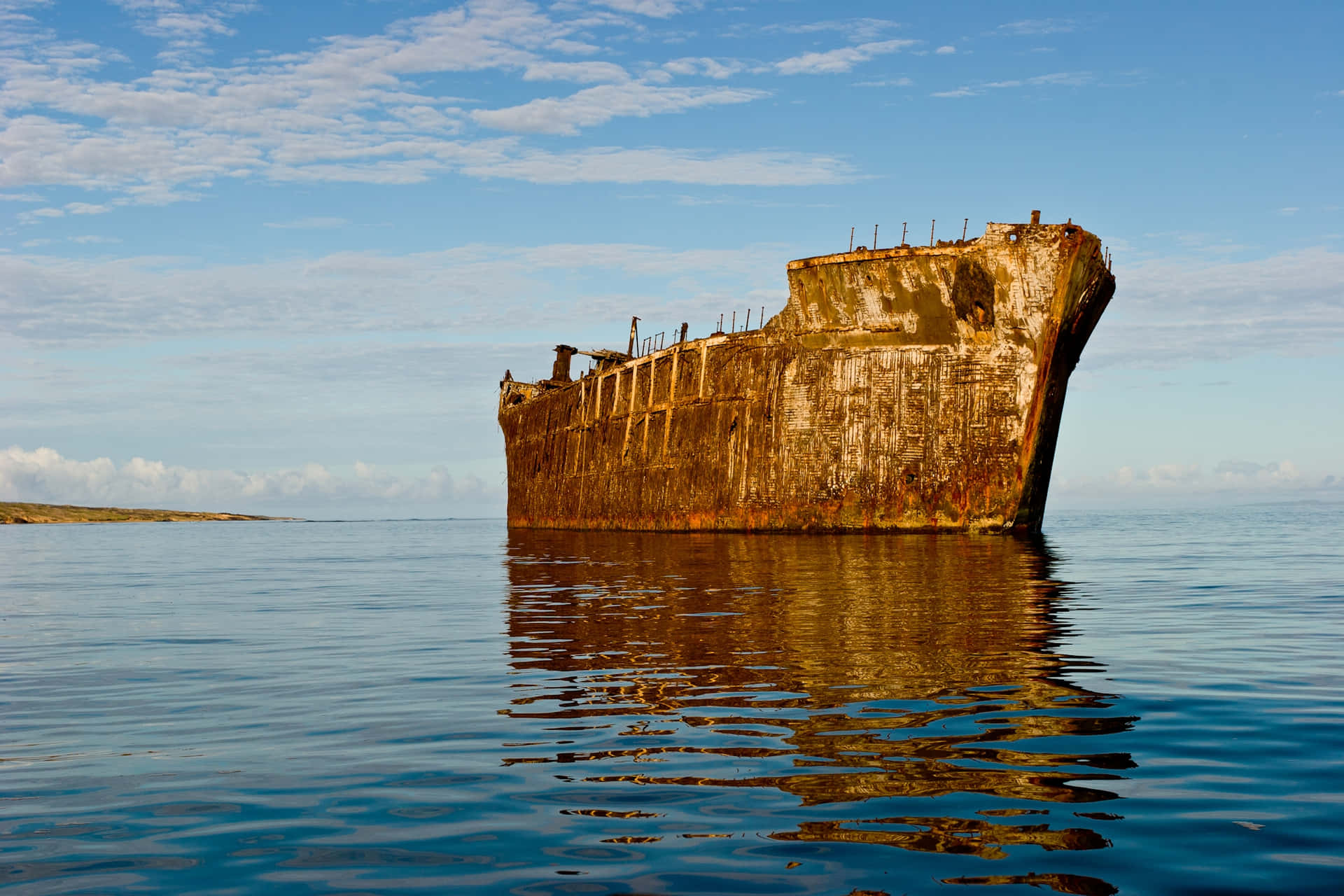 Sunken Secrets: A Spectacular Shipwreck Rests Beneath Crystal Clear Waters Wallpaper