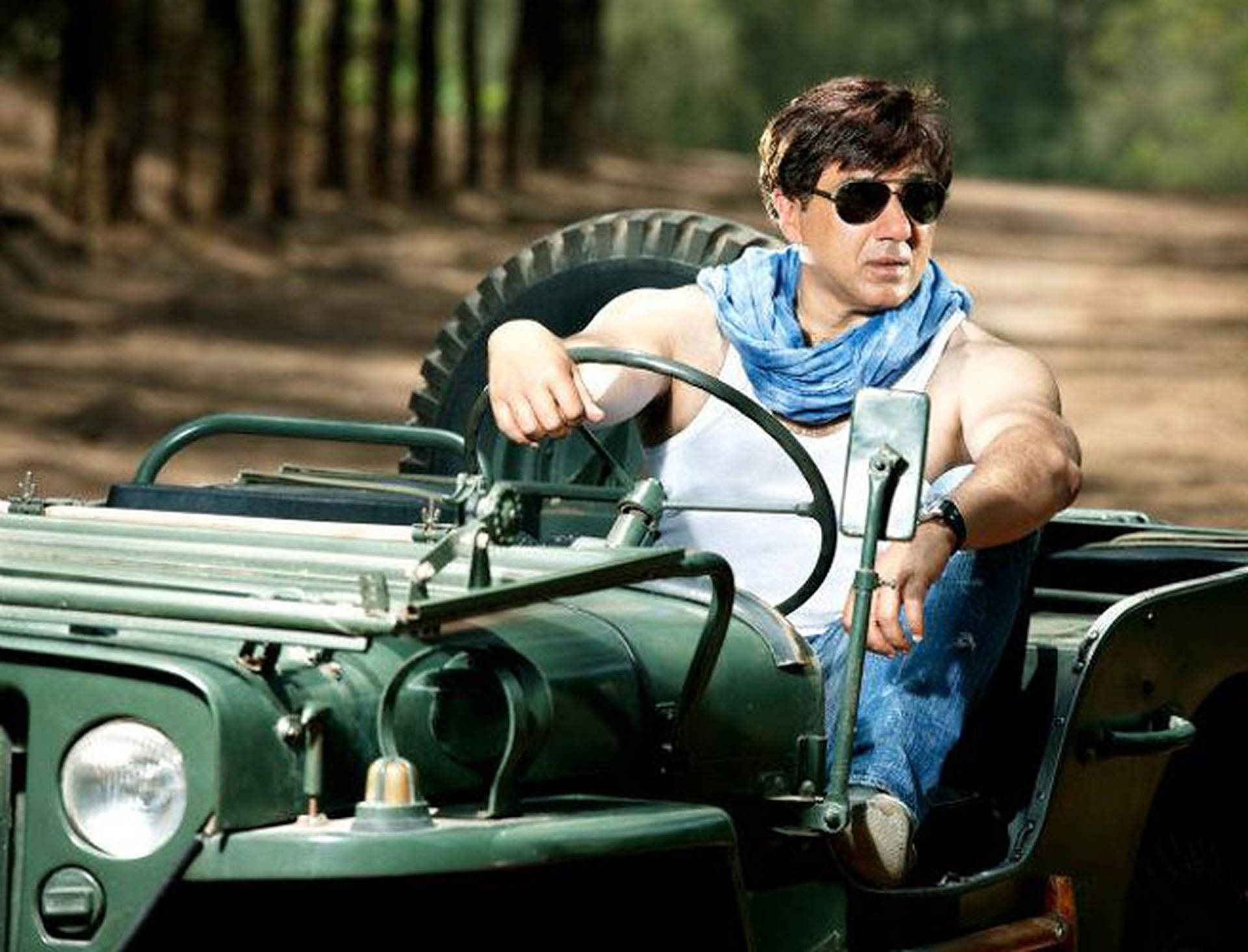 Sunny Deol In Green Vehicle Wallpaper