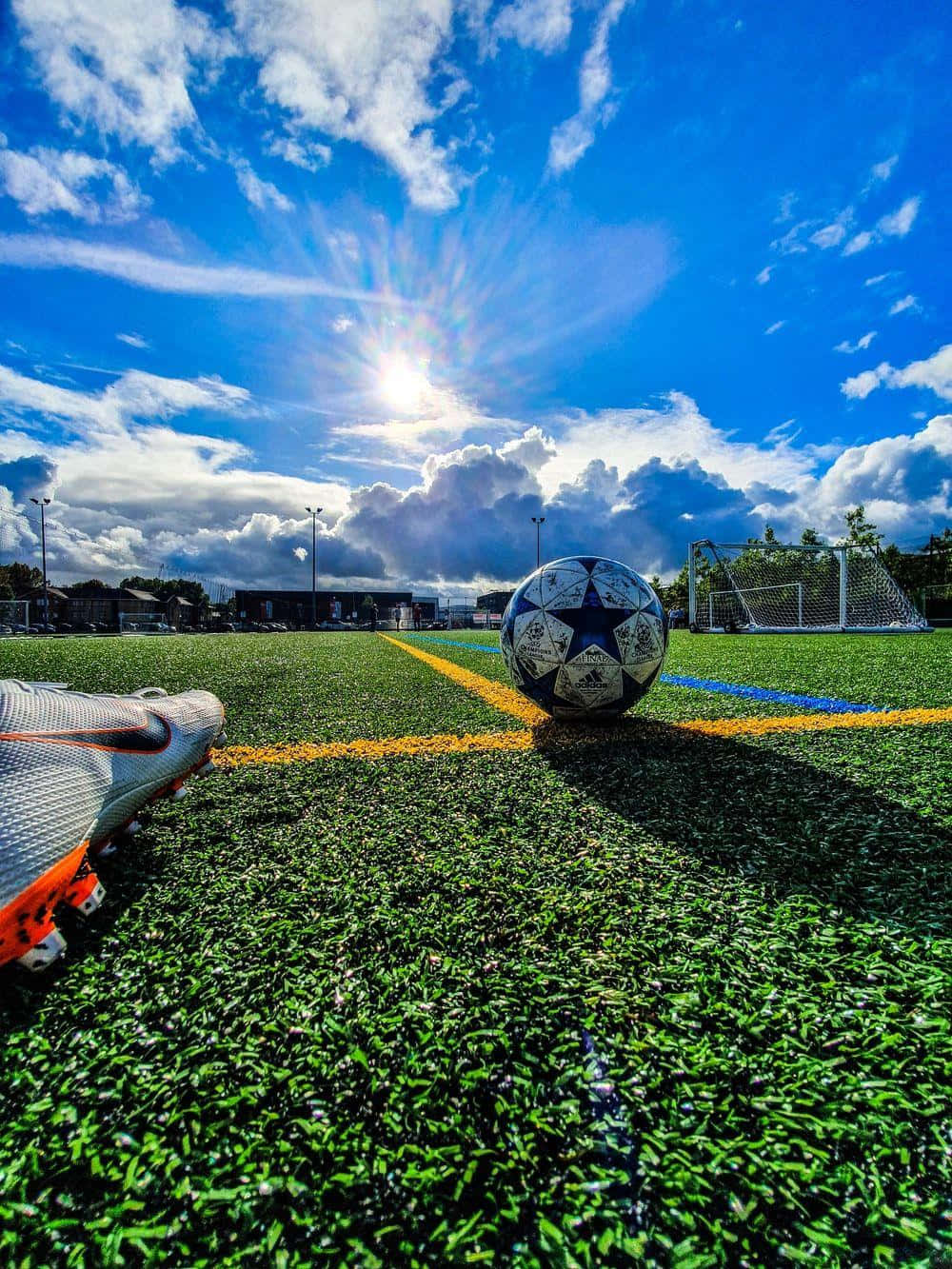 Sunny Soccer Fieldand Ball.jpg Wallpaper