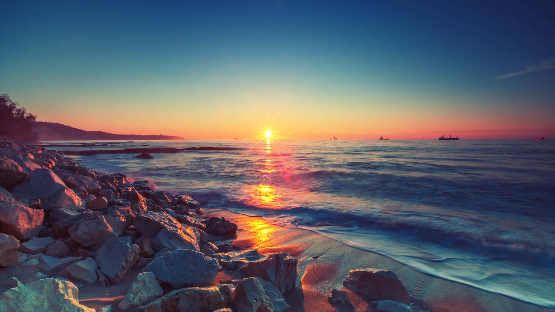 "A beautiful sunrise illuminates the horizon."