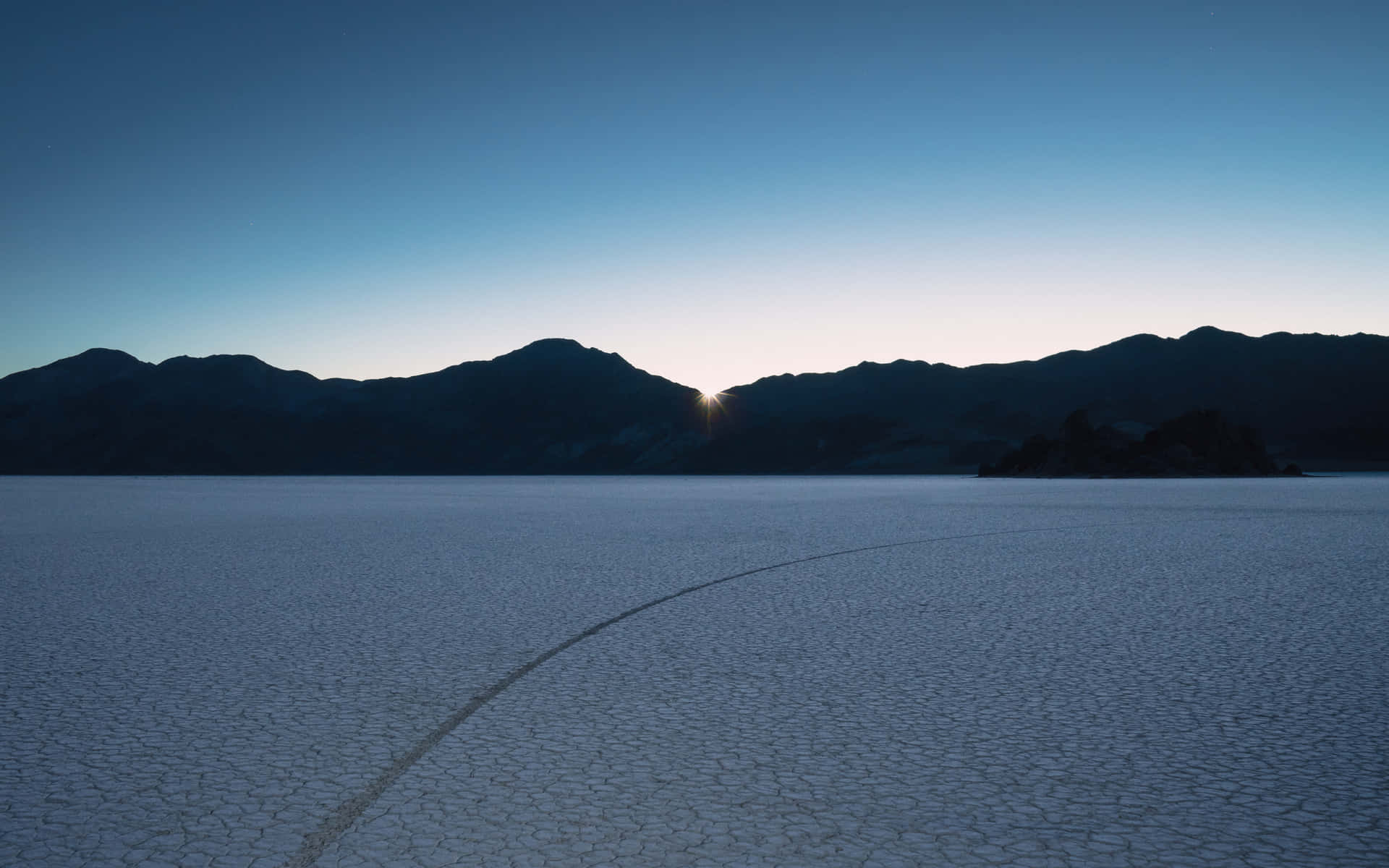 Sunrise Over Cracked Desert Wallpaper