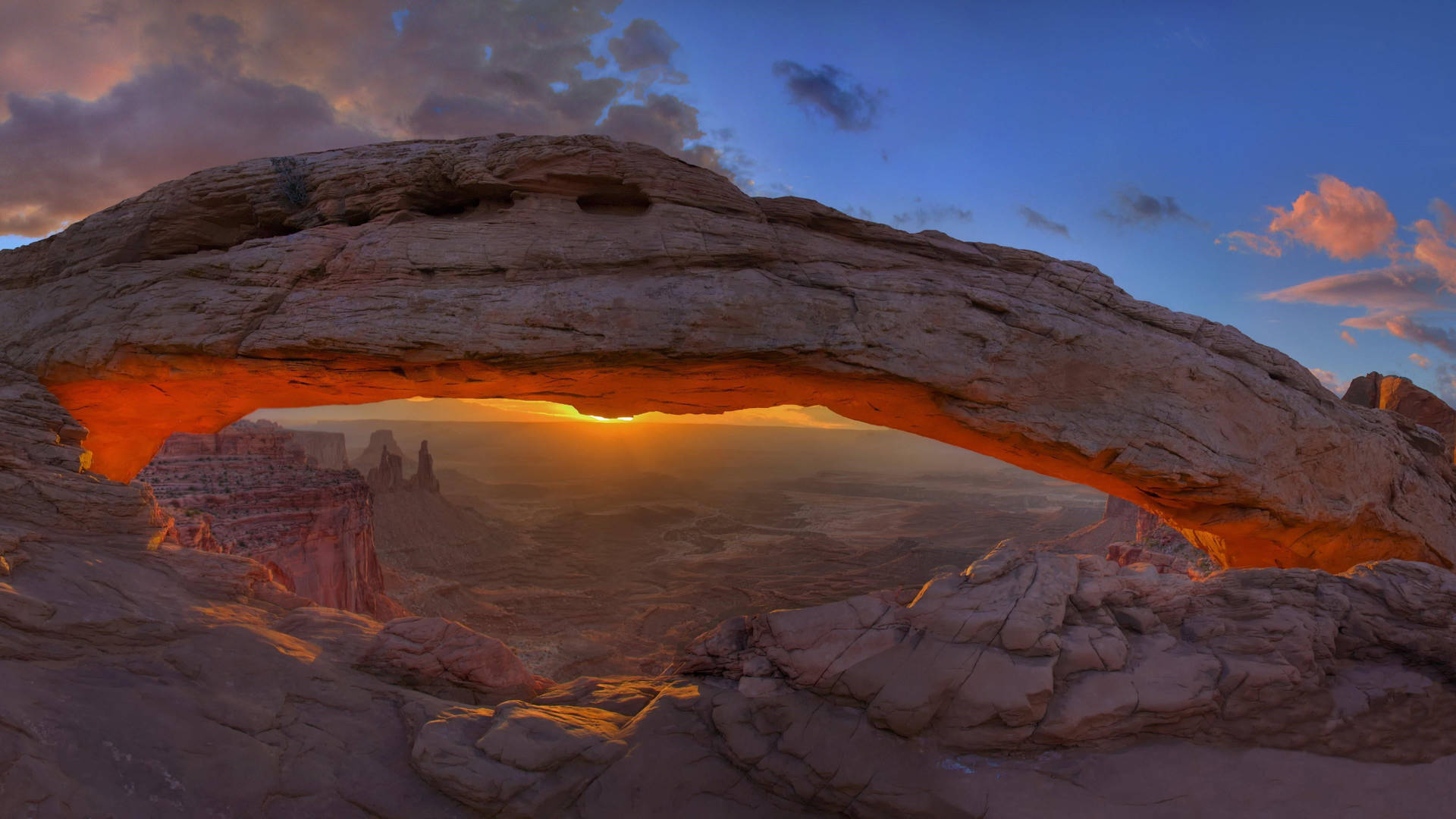 Sunset Arch In Canyonlands National Park Wallpaper
