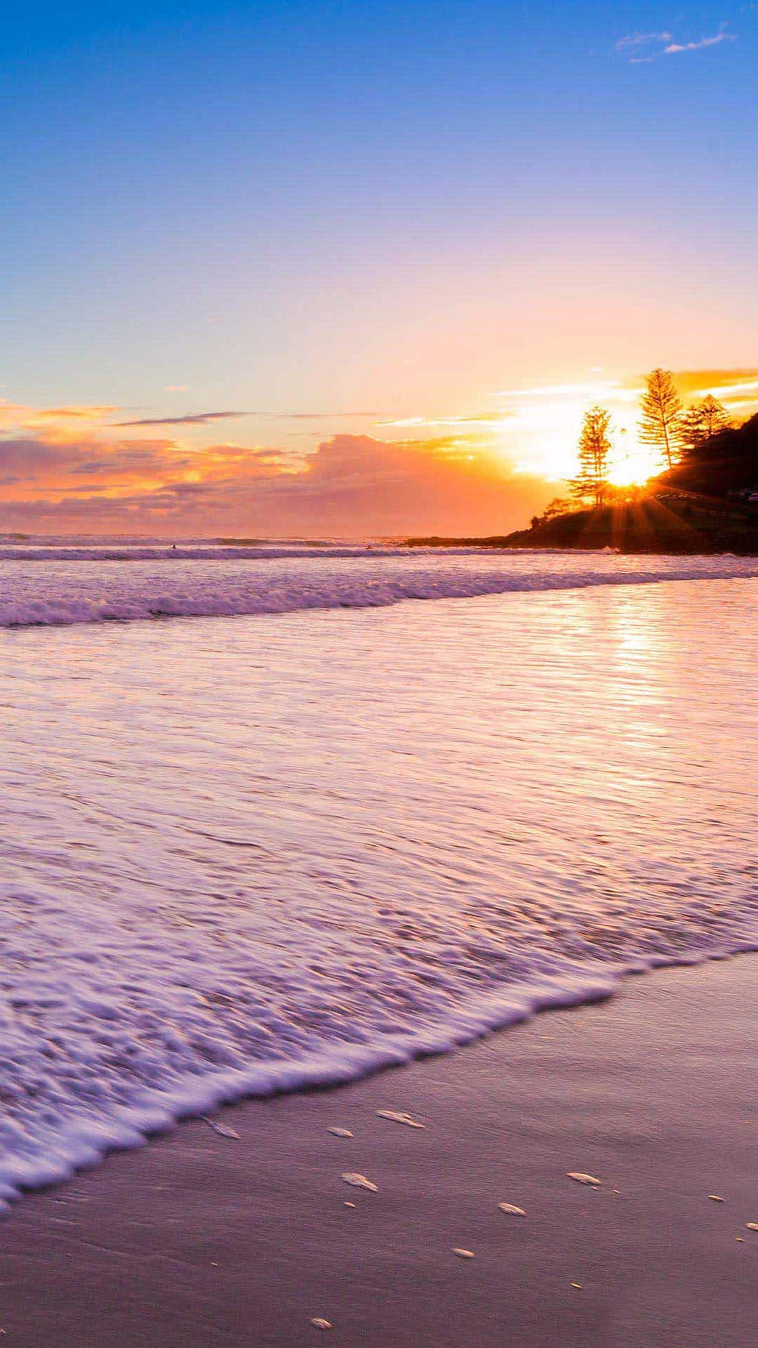 Disfrutade La Belleza Del Sol Poniente En Una Playa Virgen. Fondo de pantalla