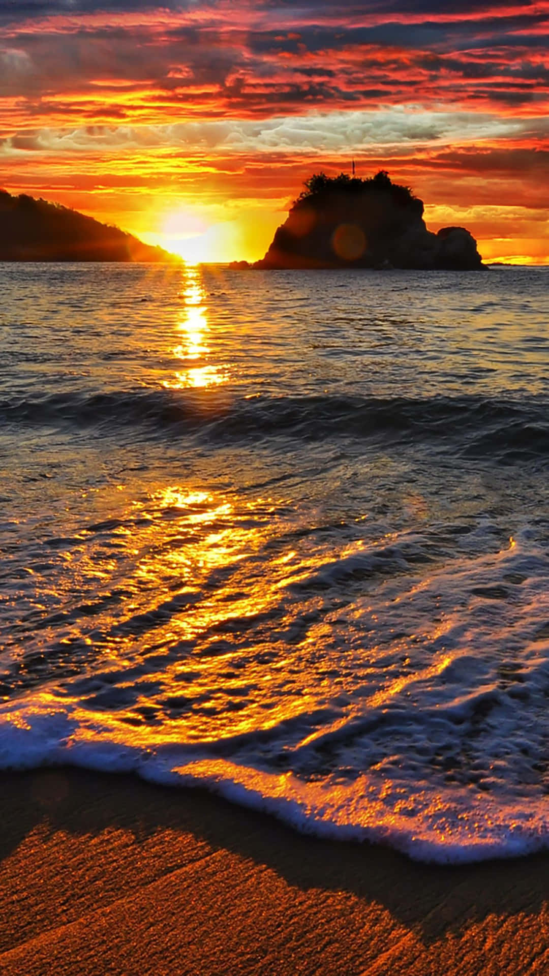 A Sunset On A Beach With Waves Wallpaper