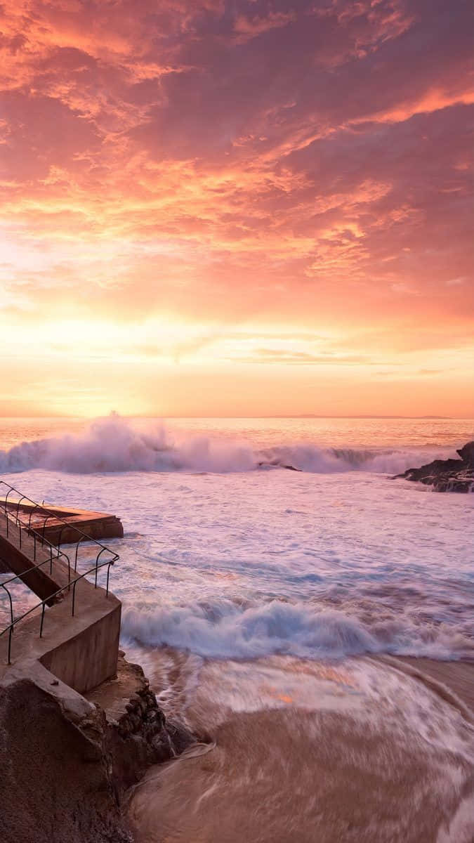 Fangensie Den Perfekten Sonnenuntergangsmoment Mit Dieser Wunderschönen Strandkulisse Ein. Wallpaper