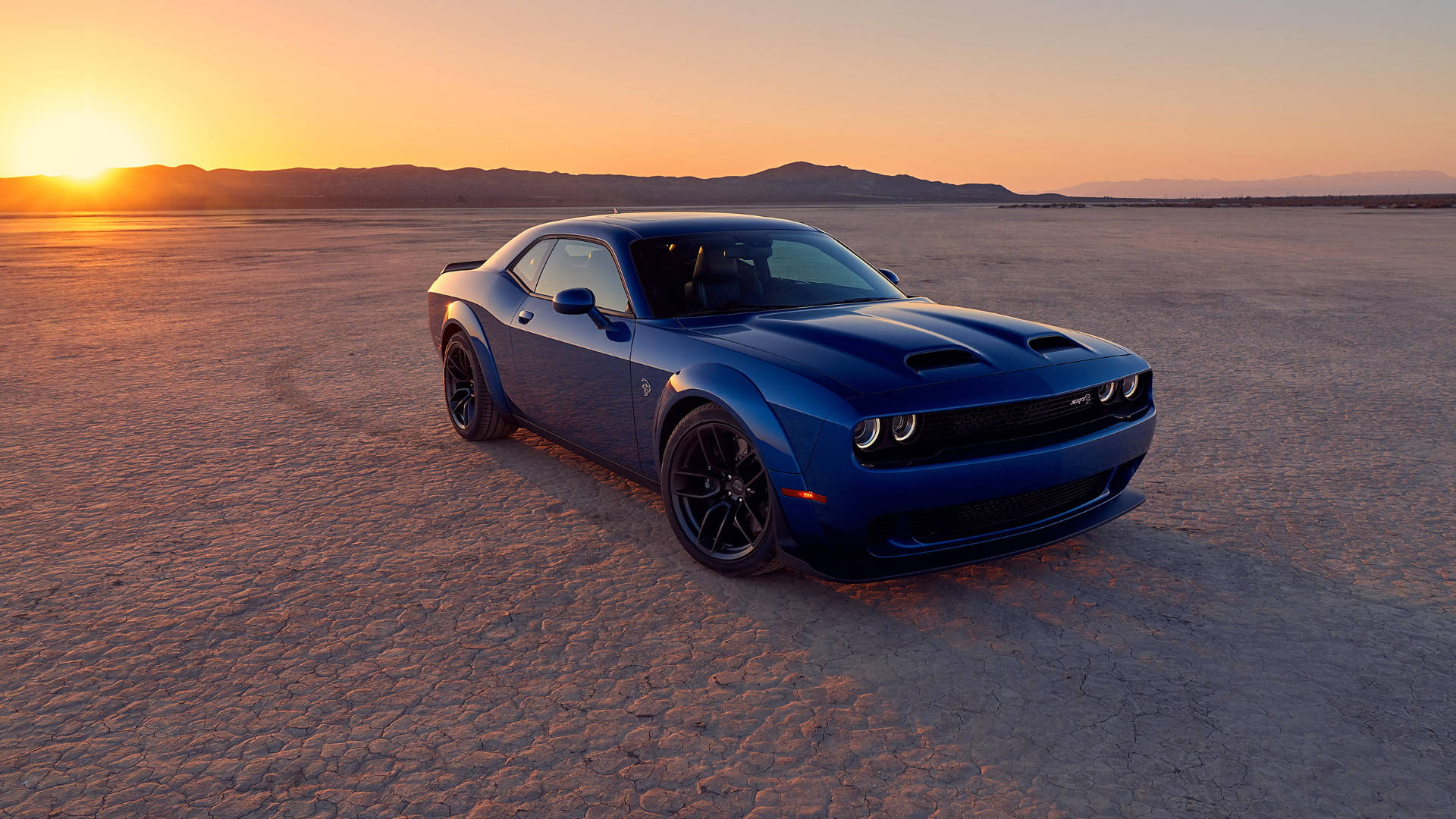 Sunset Behind A Blue Dodge Challenger Background