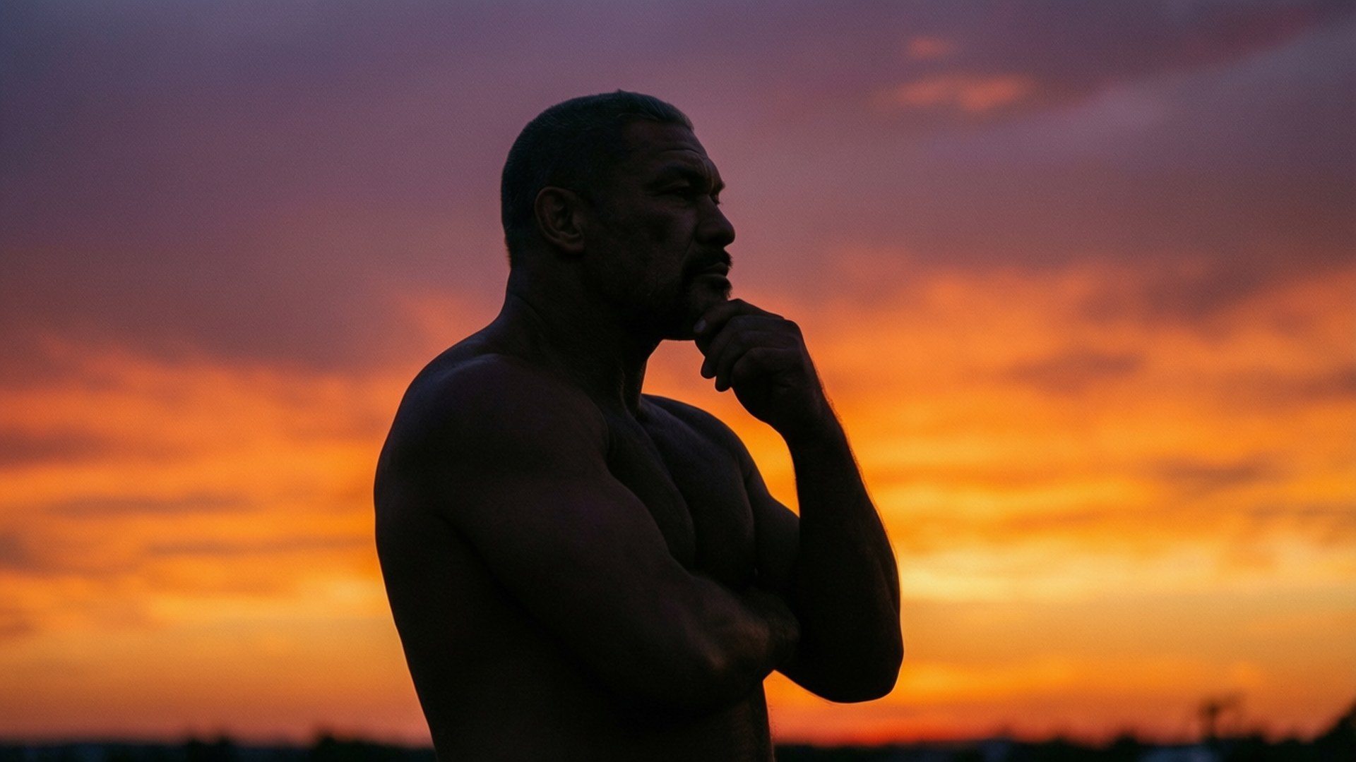 Silhuett av BJ Penn mot en fargerik solnedgang, som reflekterer over karrieren hans.