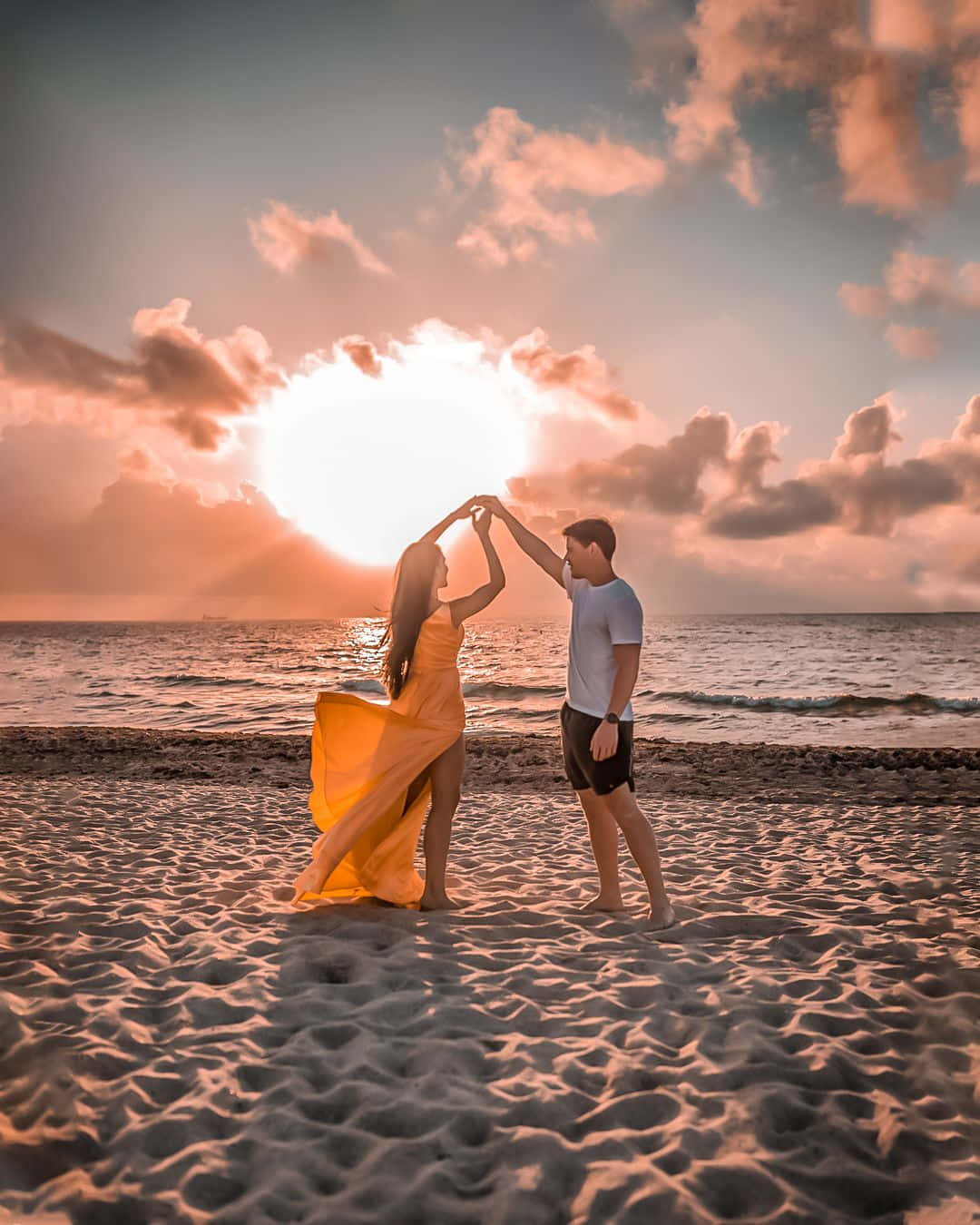 Couple Enjoying A Romantic Sunset Together