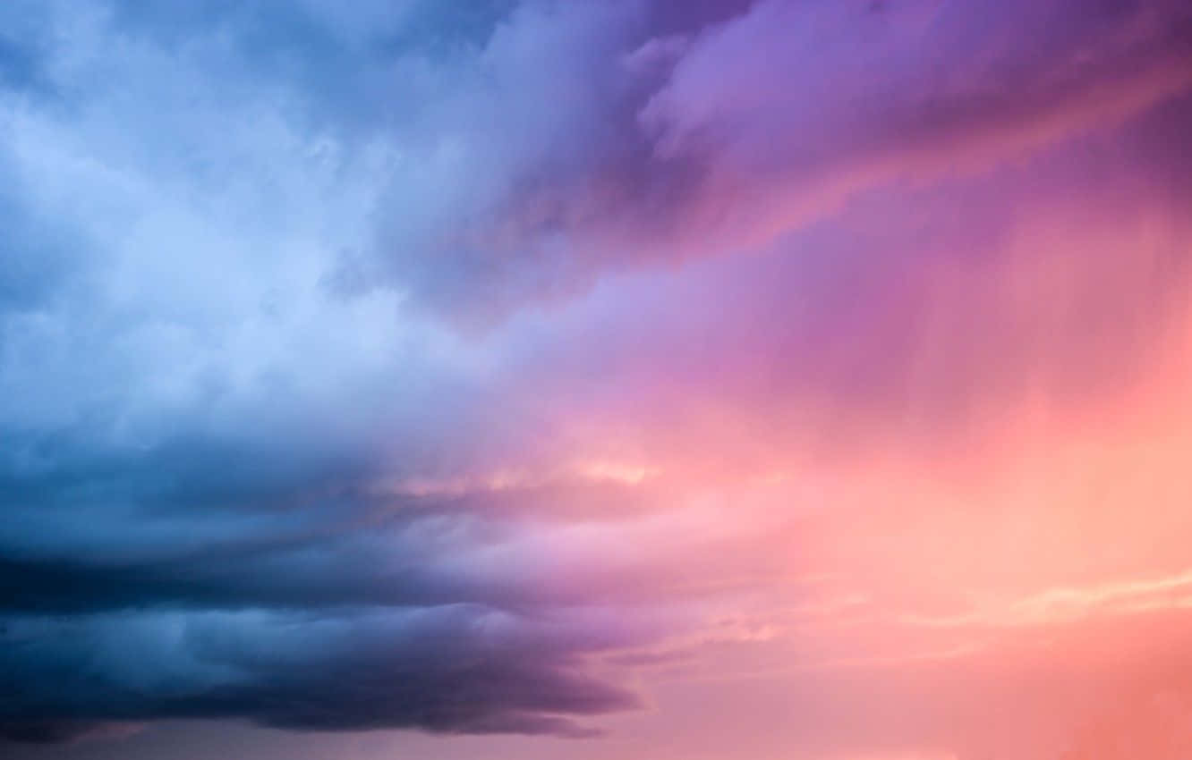 Caption: Mesmerizing sunset hues over the calm ocean Wallpaper
