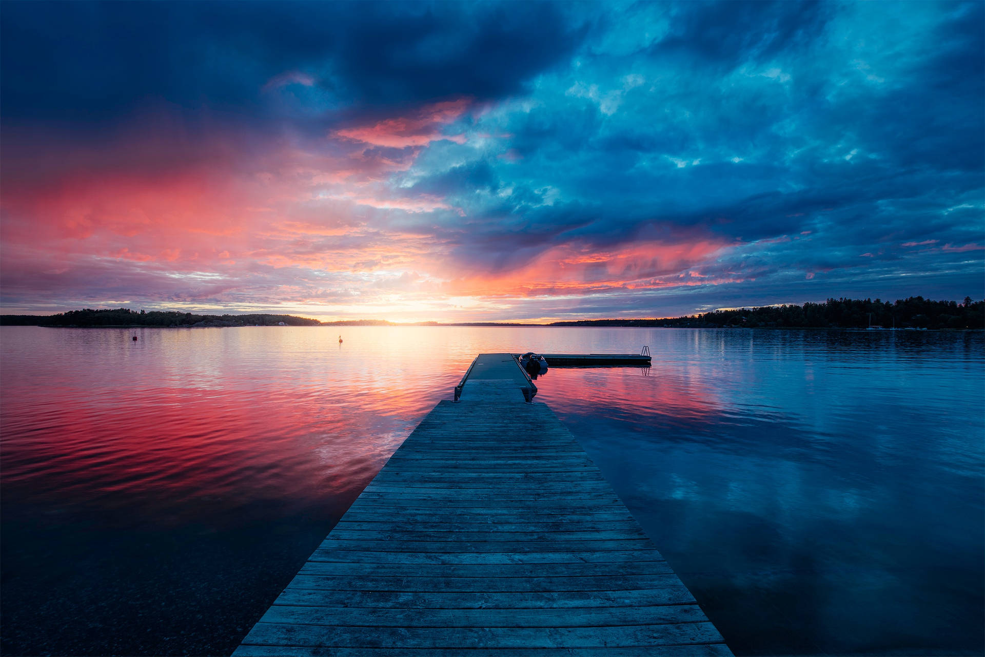 Sunset In Boat Dock's Blue Hue Clouds Wallpaper
