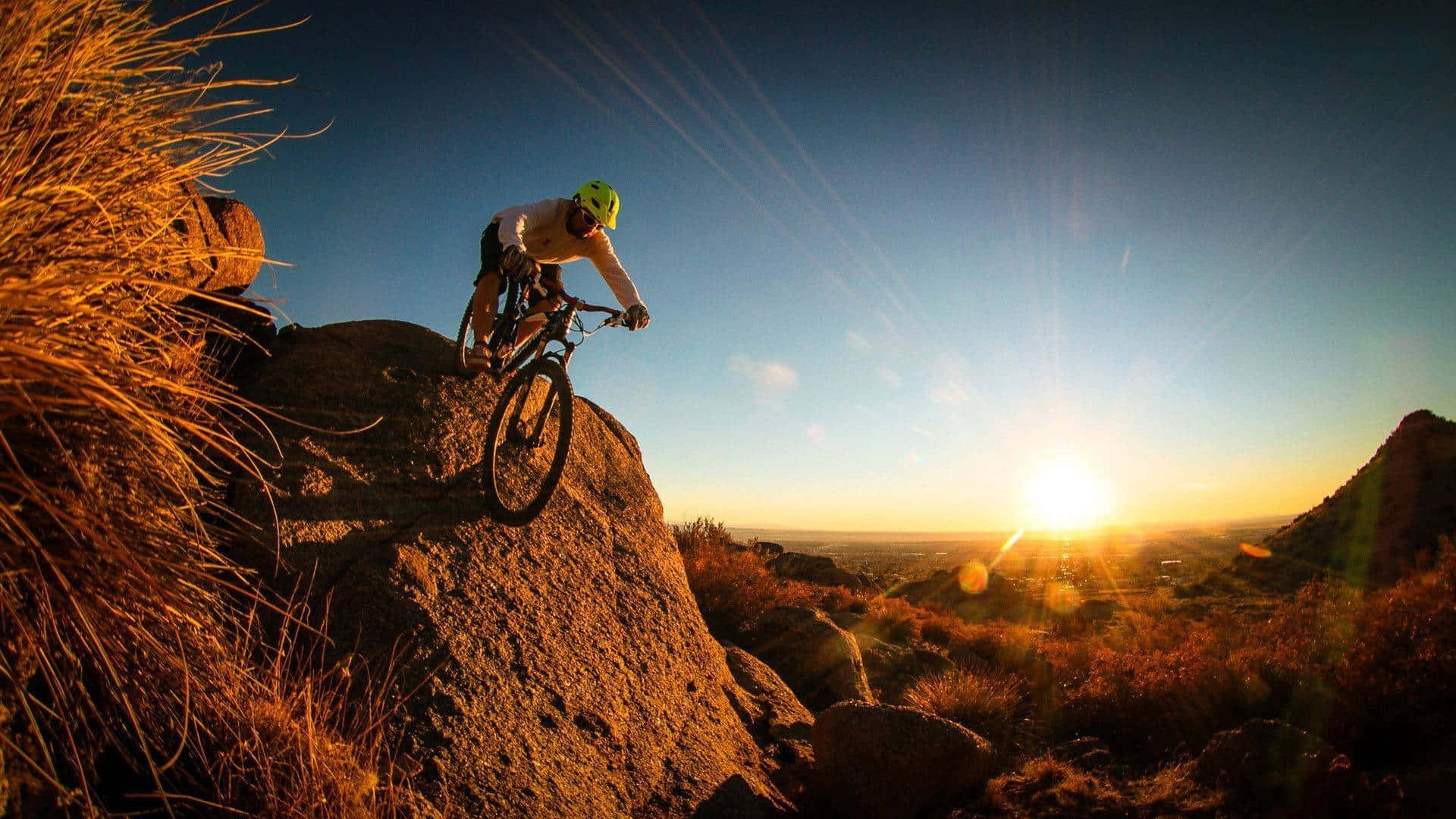 Sunset Mountain Biking Adventure Wallpaper