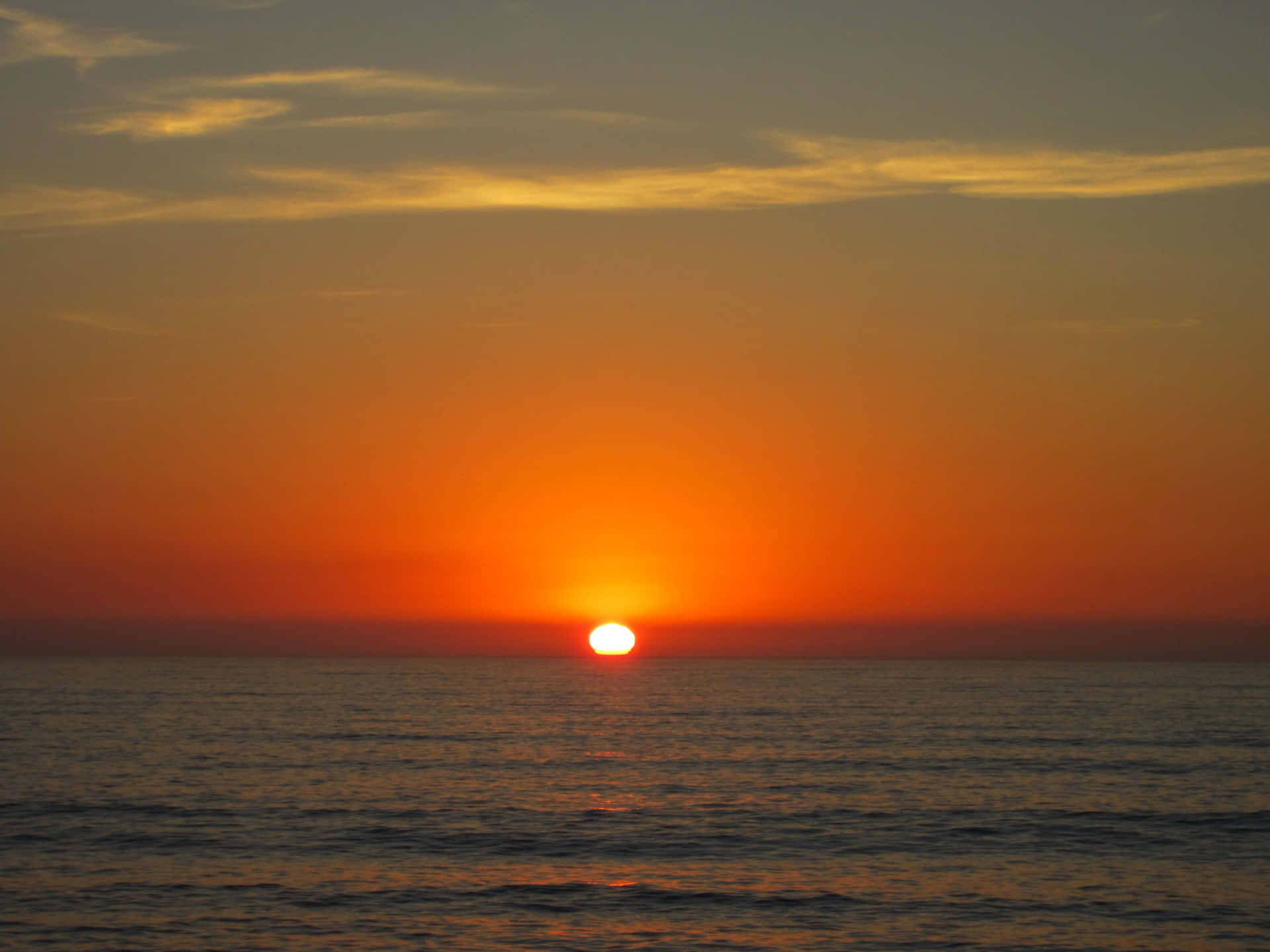 Serene Sunset Over Ocean Waves