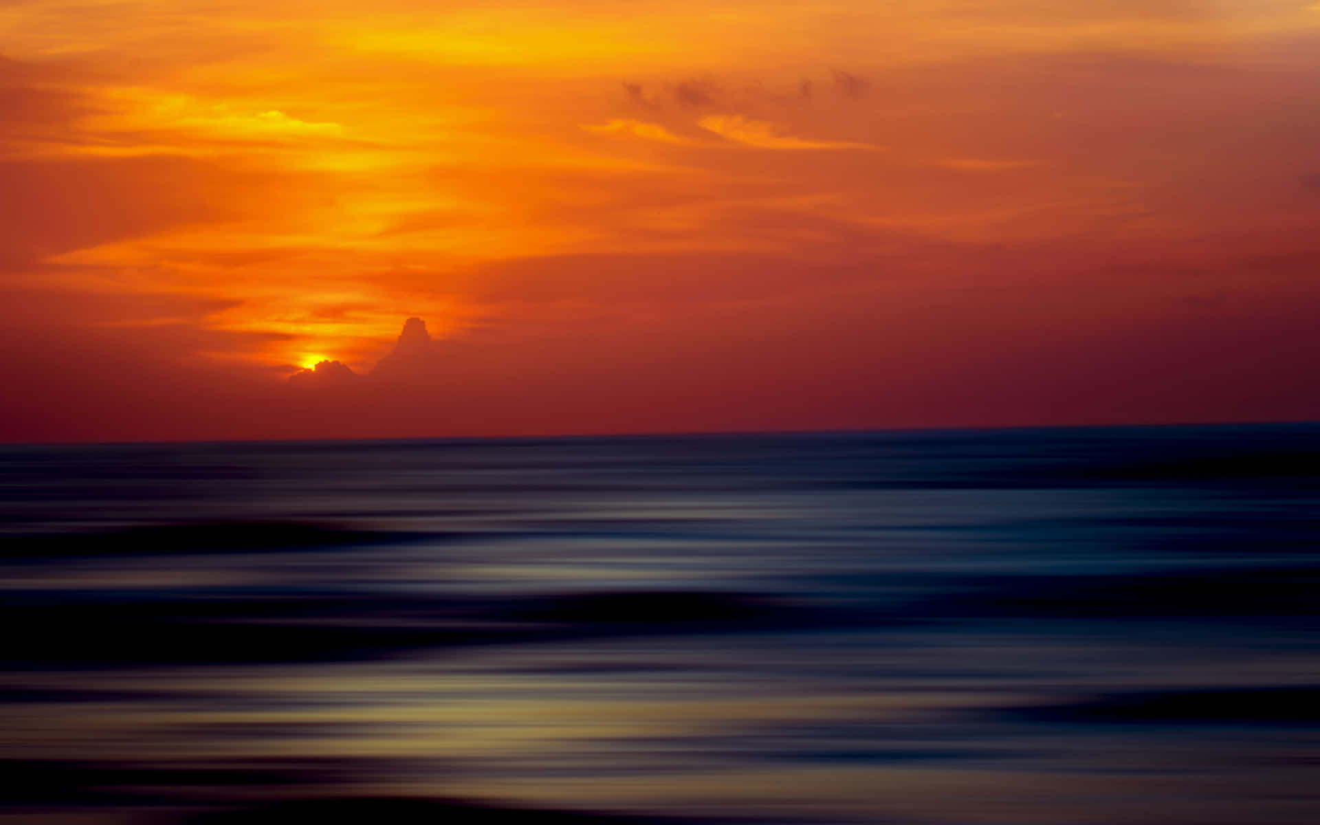 Tranquil Ocean Sunset with Golden Horizon