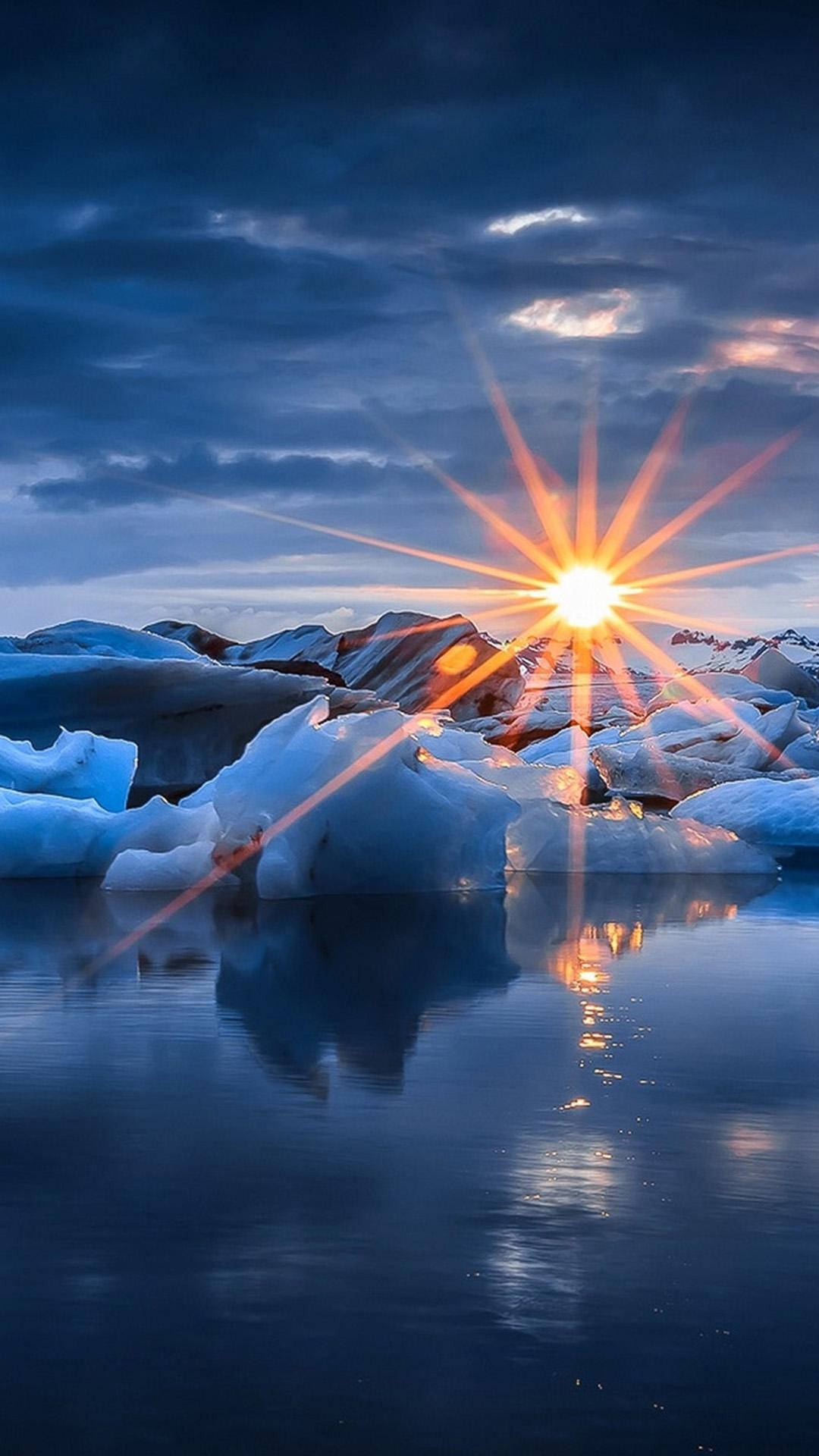 Solnedgångöver Isen Iphone Se. Wallpaper