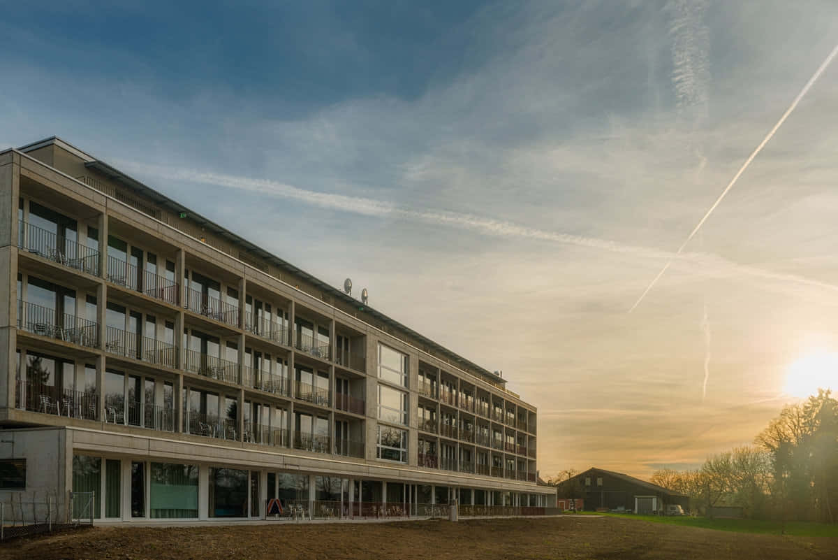 Sunset Over Modern Building Frauenfeld Wallpaper