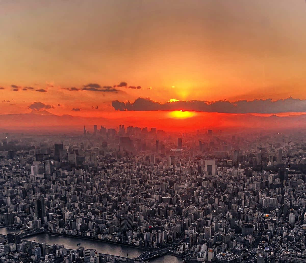 Sunset_ Over_ Urban_ Skyline Wallpaper