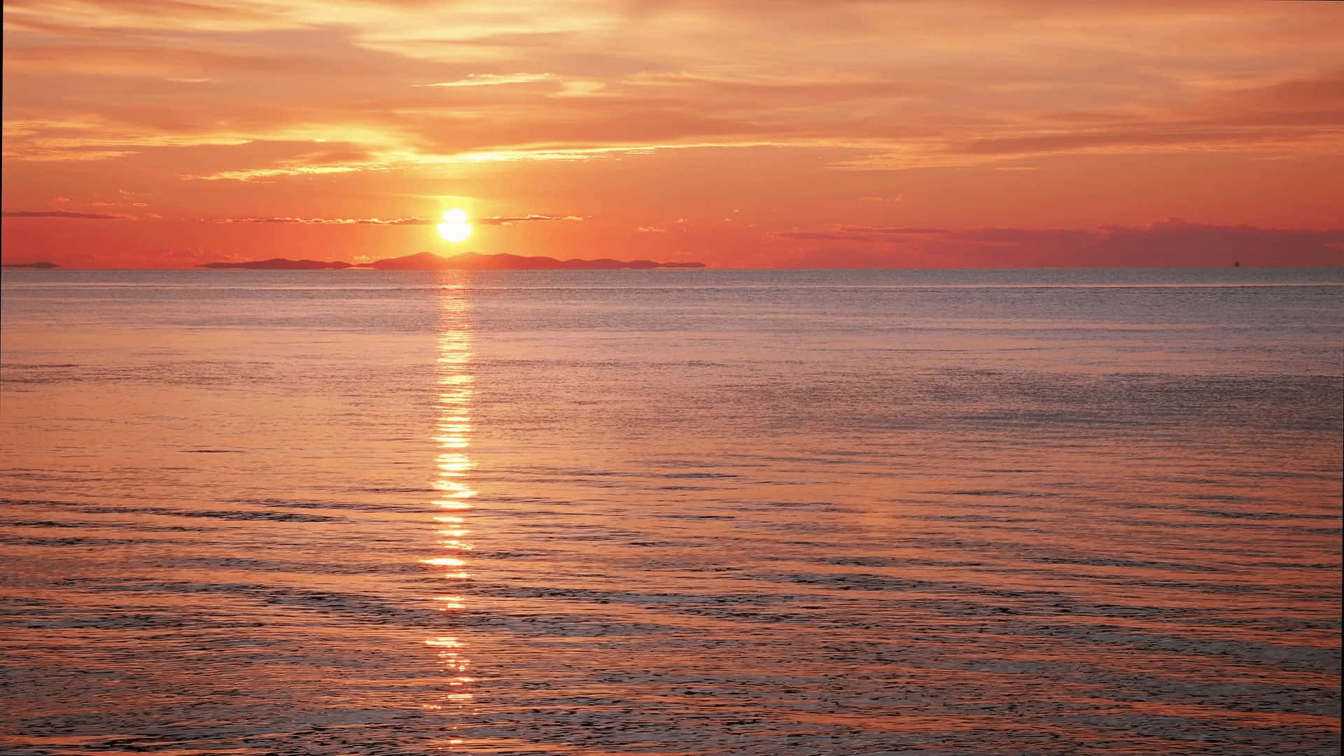 Stunning Sunset Reflection Over a Calm Lake Wallpaper