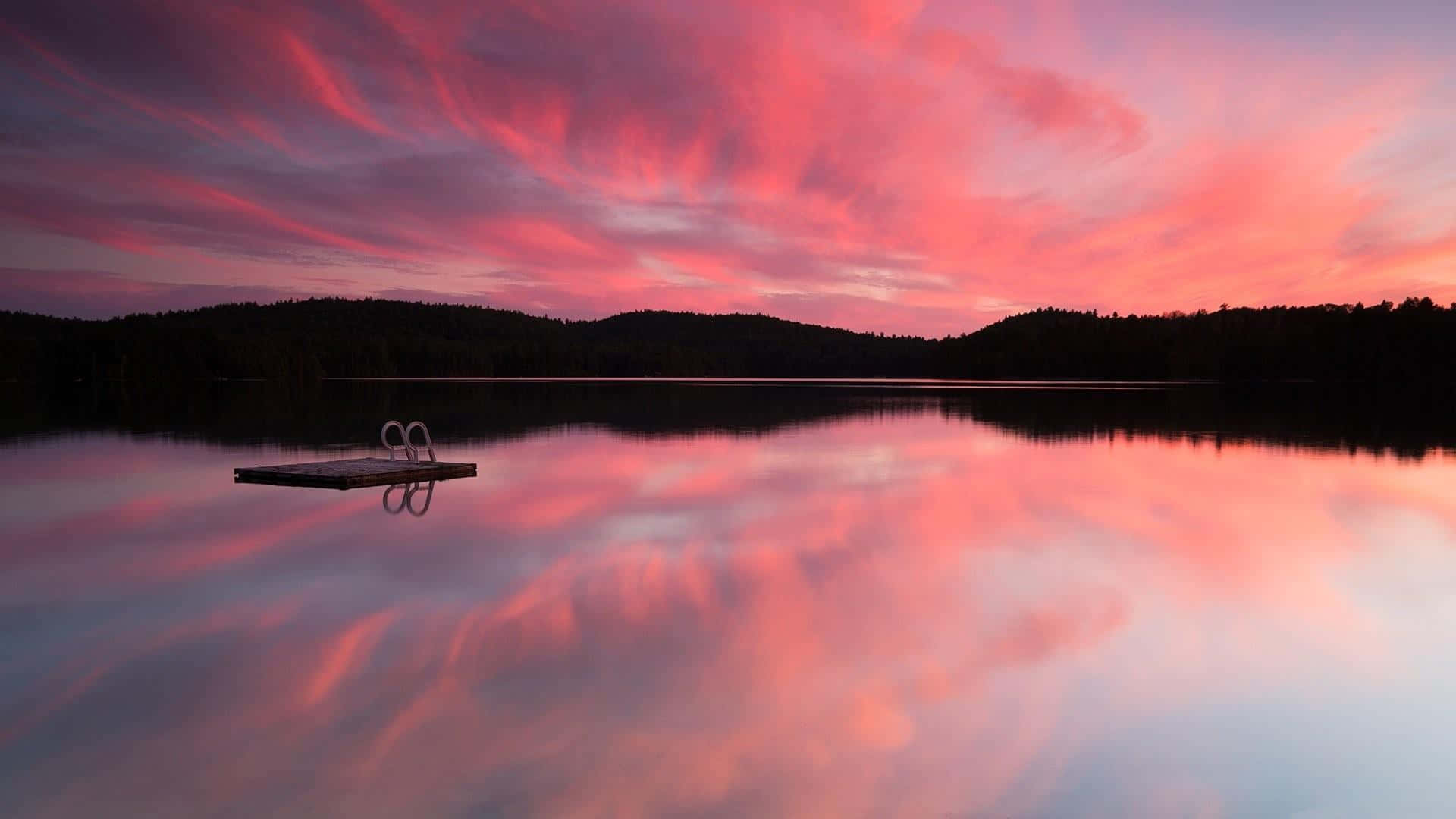 Stunning Sunset Reflection on Calm Waters Wallpaper