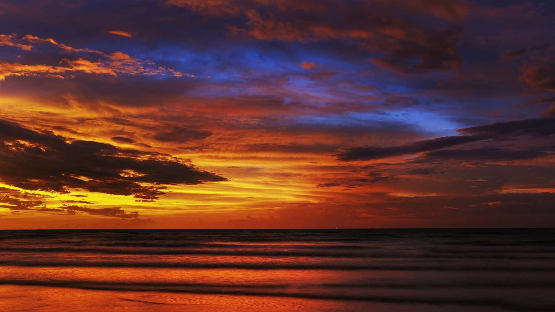 Spectacular Sunset View Overlooking the Serene Ocean Wallpaper