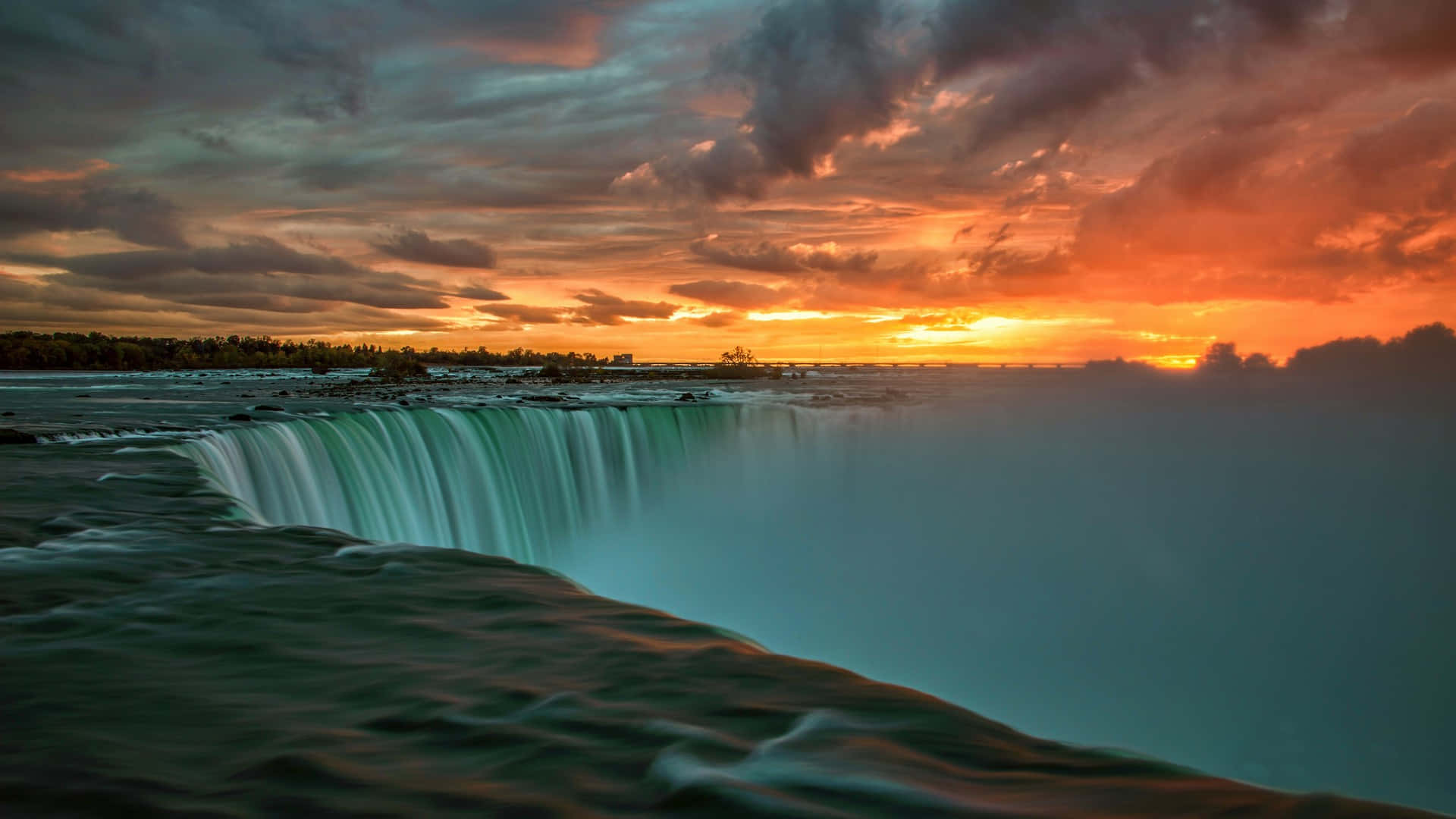 Solnedgångsutsiktöver Niagara Falls I Kanada. Wallpaper