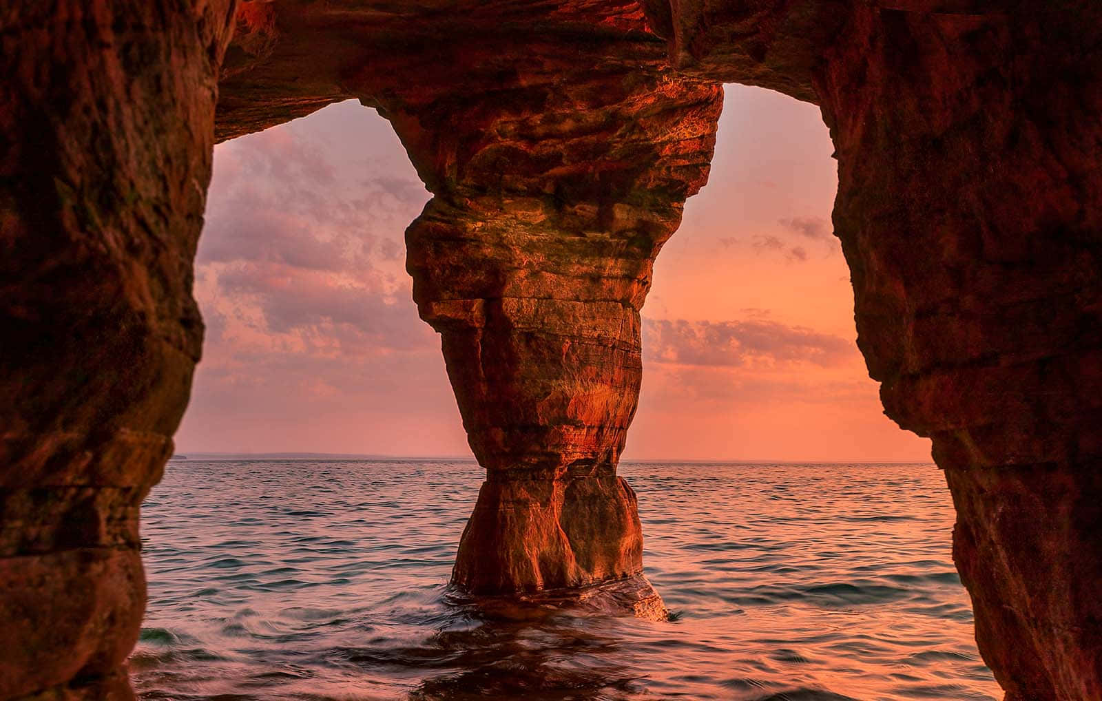 Sunset View Through Sea Cave Wallpaper