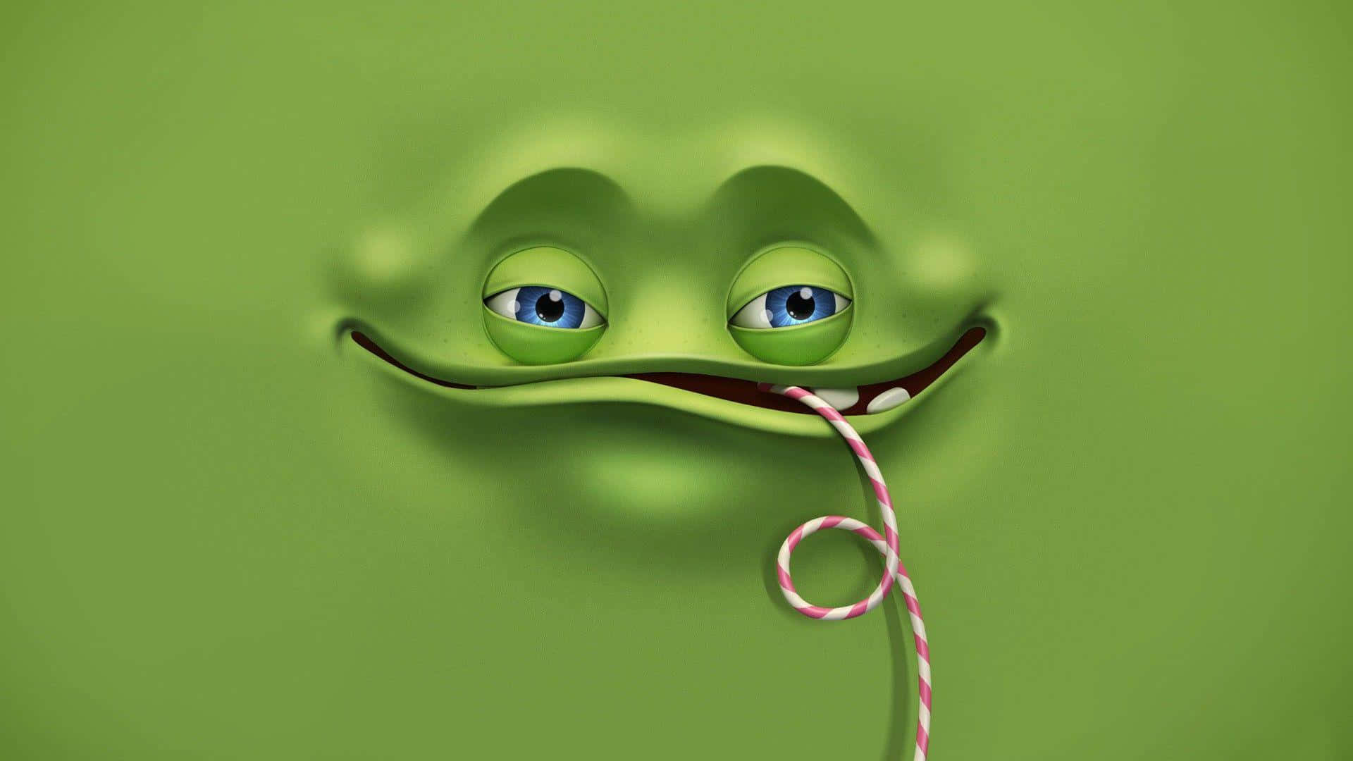 a green frog with blue eyes and a candy cane