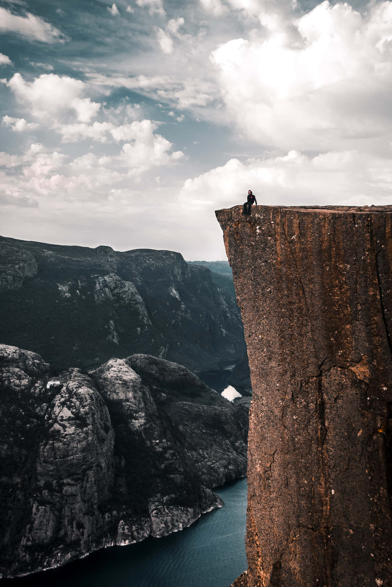 A Person Is Standing On A Cliff Wallpaper