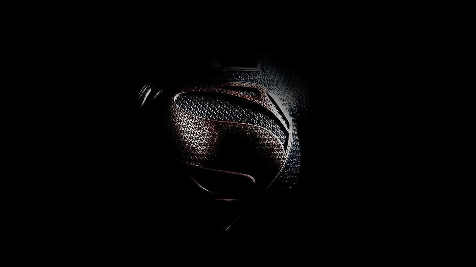 Supermananzug Auf Schwarzem Tablet Wallpaper