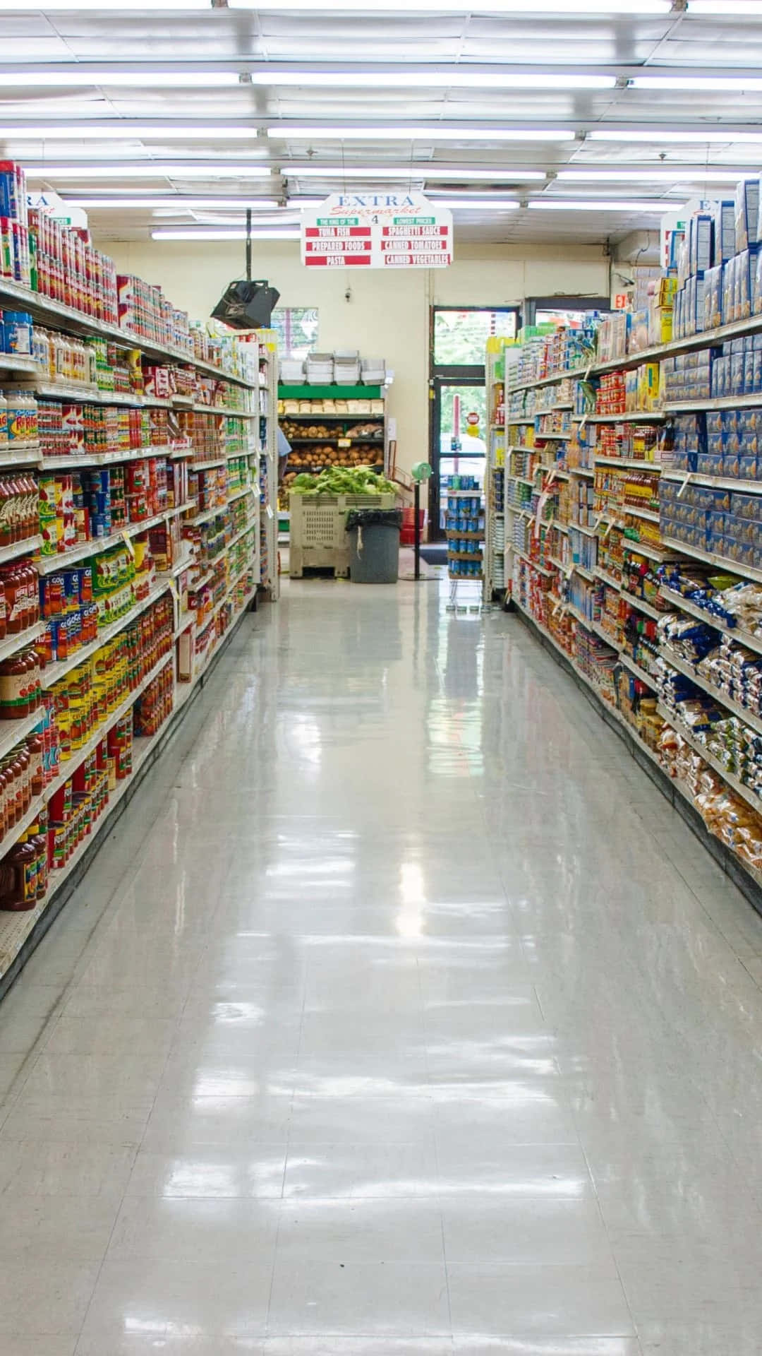 A Grocery Store With A Long Aisle