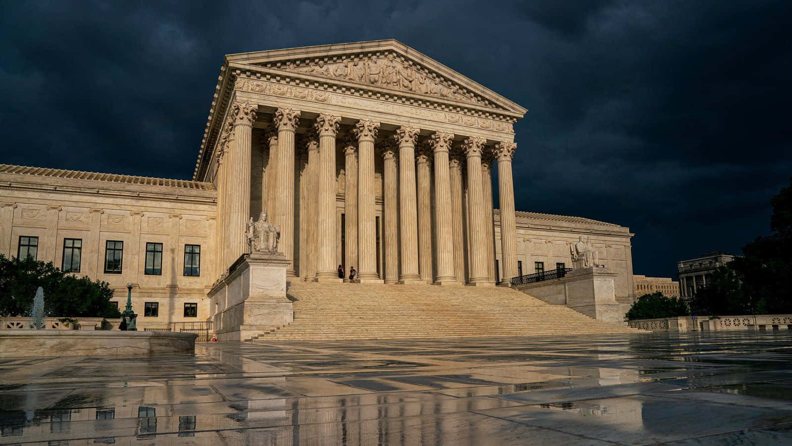 Majestic Supreme Court Building Under Rainy Sky Wallpaper