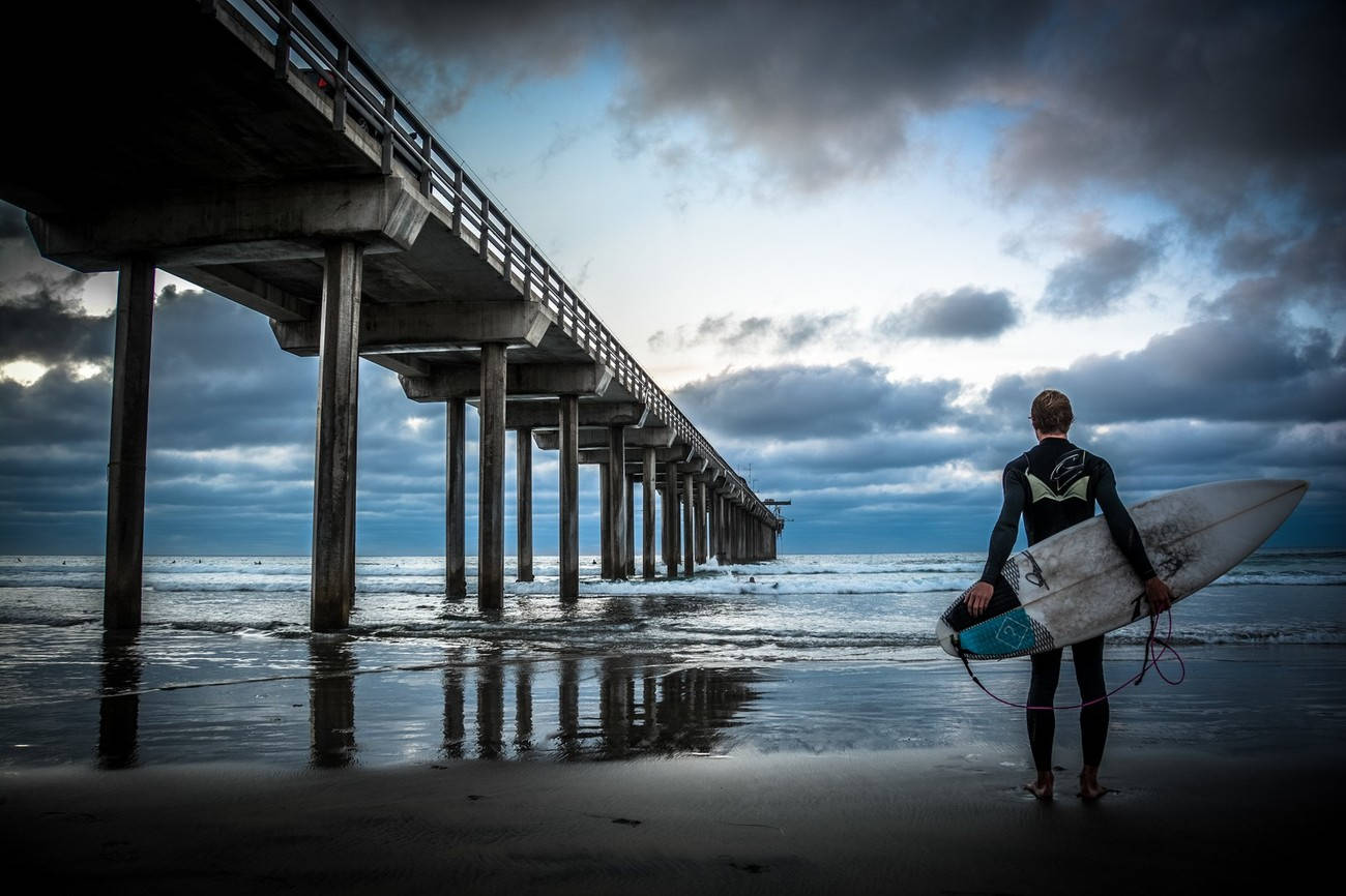 Surfer By The San Diego Pier Wallpaper