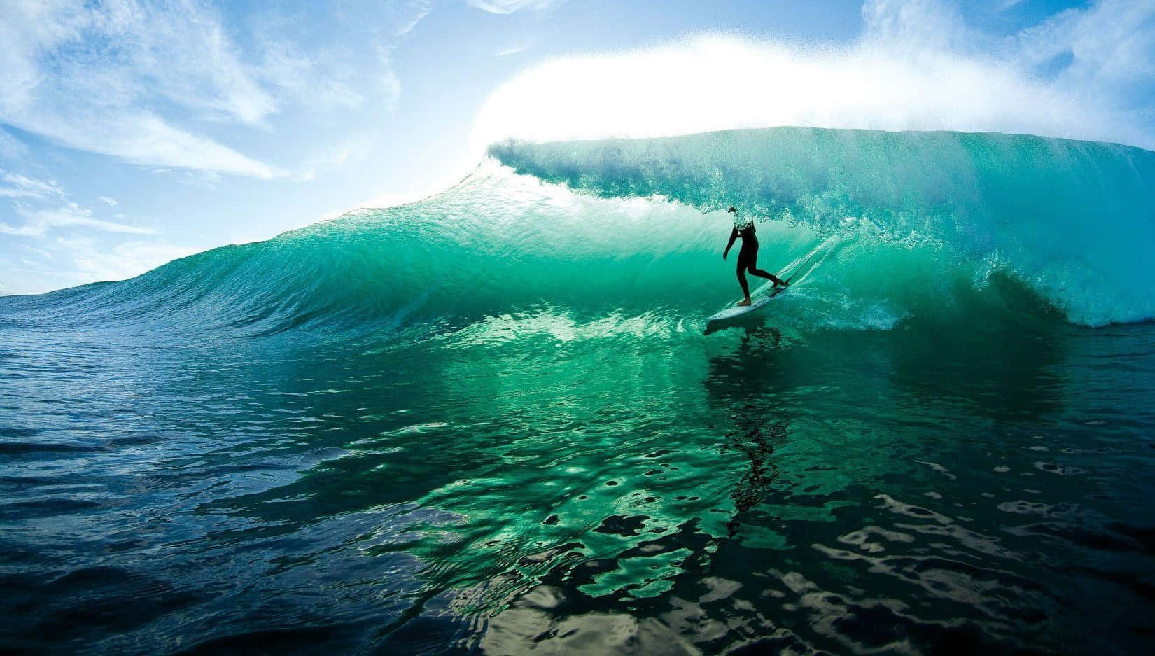 Surfer conquering big waves